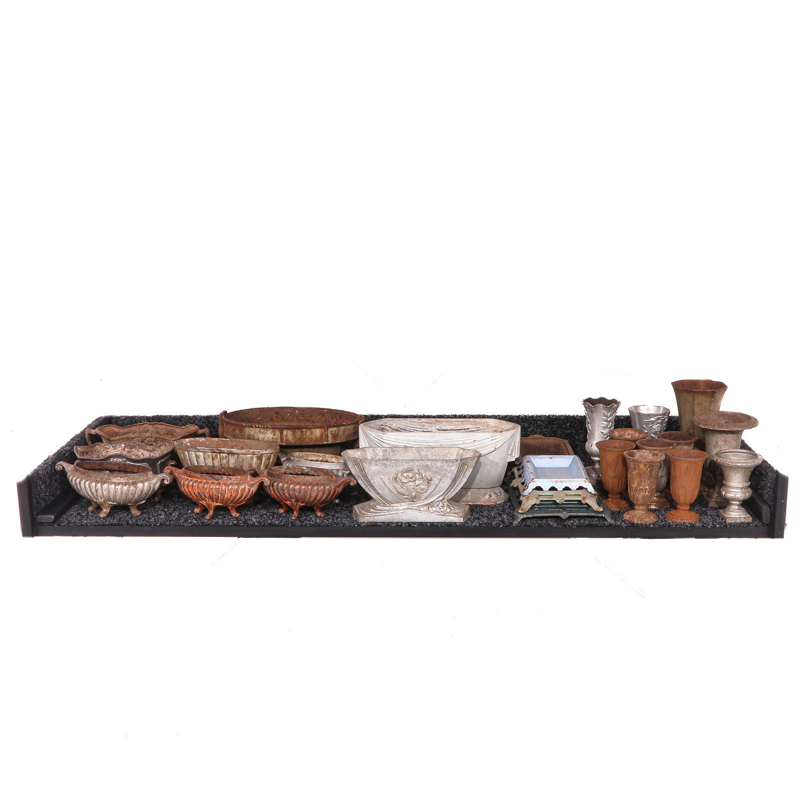 A Group of Cast Iron Planters: Consisting of various cast iron jardinières and planters, in different shapes and finishes, longest 40 cm.