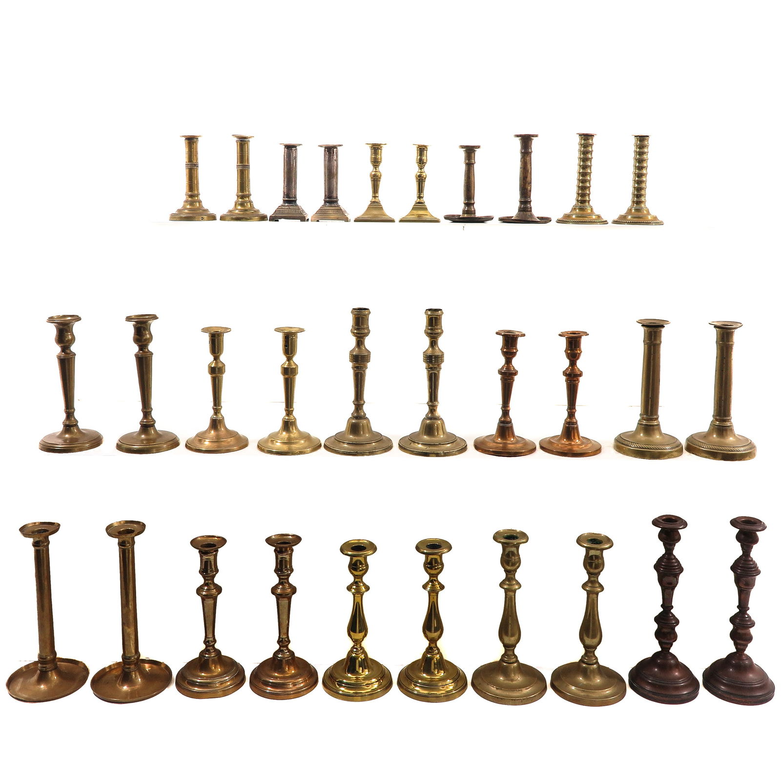 A Group of 30 19th Century Candlesticks: Consisting of thirty candlesticks in various sizes and styles, 19th century, height 26 cm.