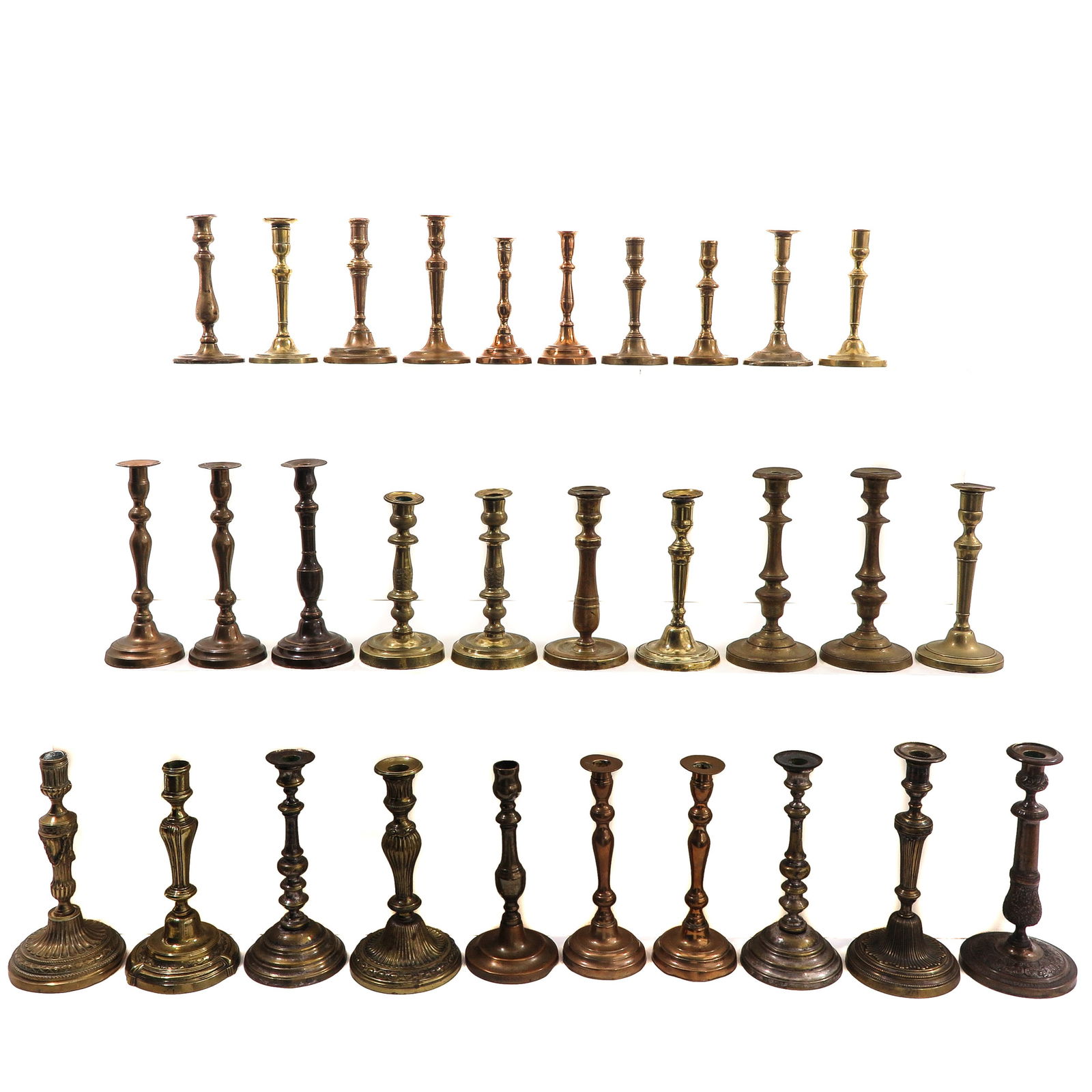 A Group of 30 19th Century Candlesticks: Consisting of thirty candlesticks in various sizes and models, 19th century, tallest 29 cm.