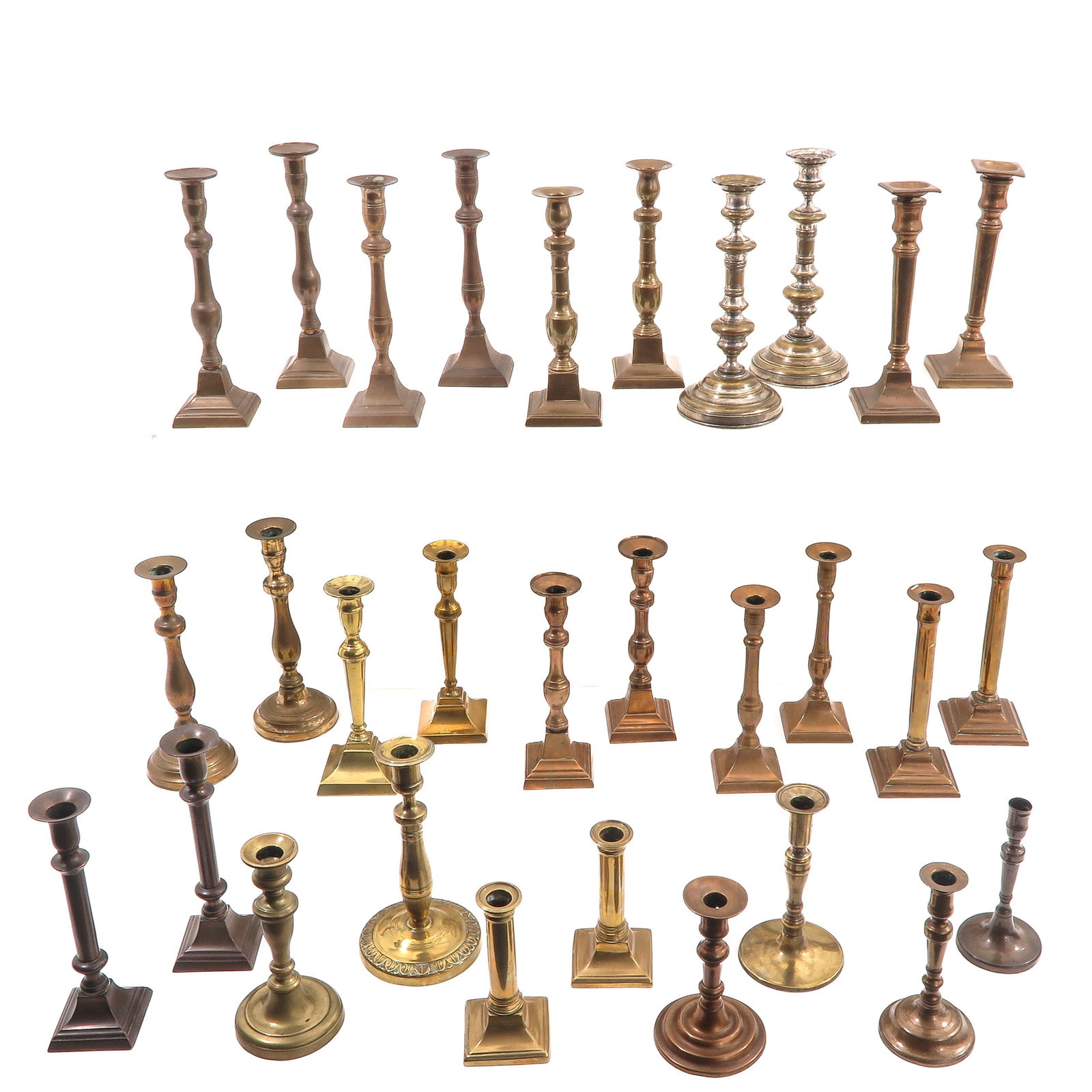 A Group of 30 19th Century Candlesticks: Consisting of thirty candlesticks in various sizes and models, 19th century, tallest 29 cm.