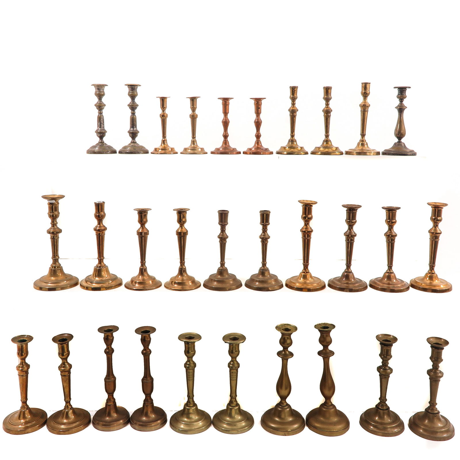 A Group of 30 19th Century Candlesticks: Consisting of thirty candlesticks in various sizes and styles, 19th century, height 28 cm.