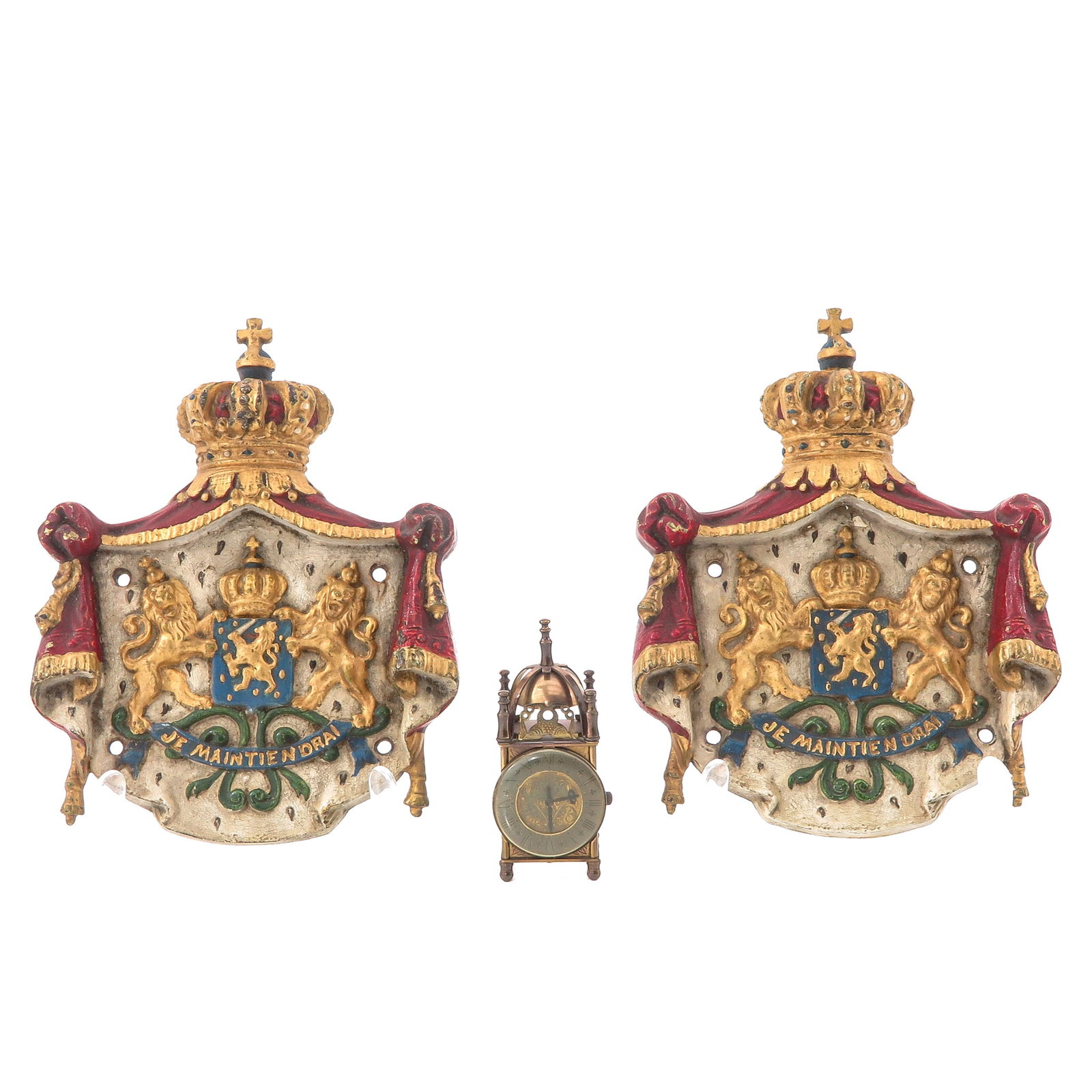 A Lot of 2 Small Cast Iron Shields: Consisting of two rare small cast iron shields for a purveyor to the Royal Household, 16 x 21 cm. Added miniature clock.