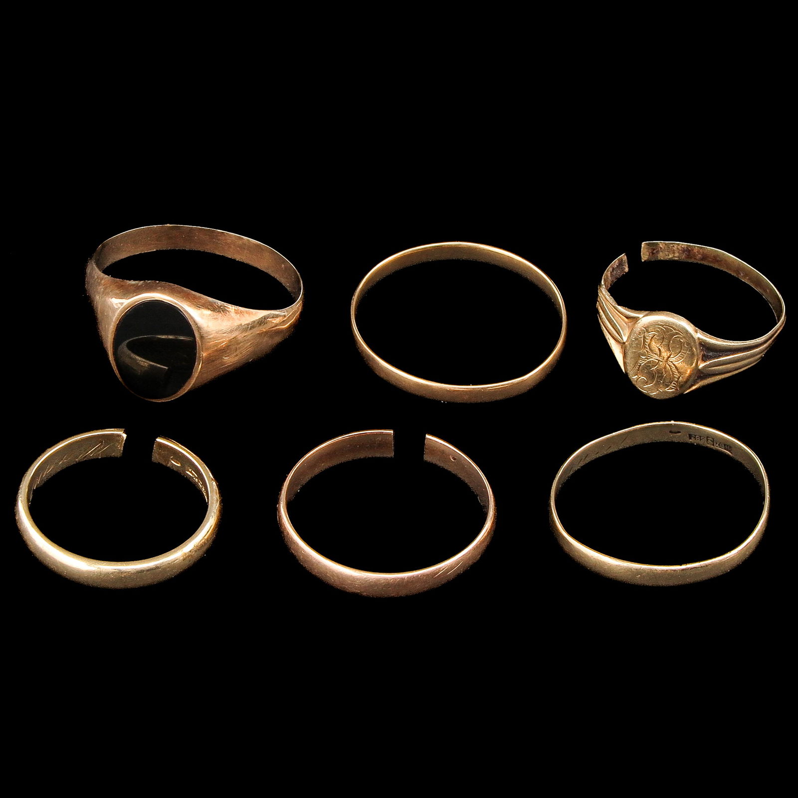A Group of 6 14KG Rings: Consisting of six 14-karat gold rings, including a signet ring, ring size 21.