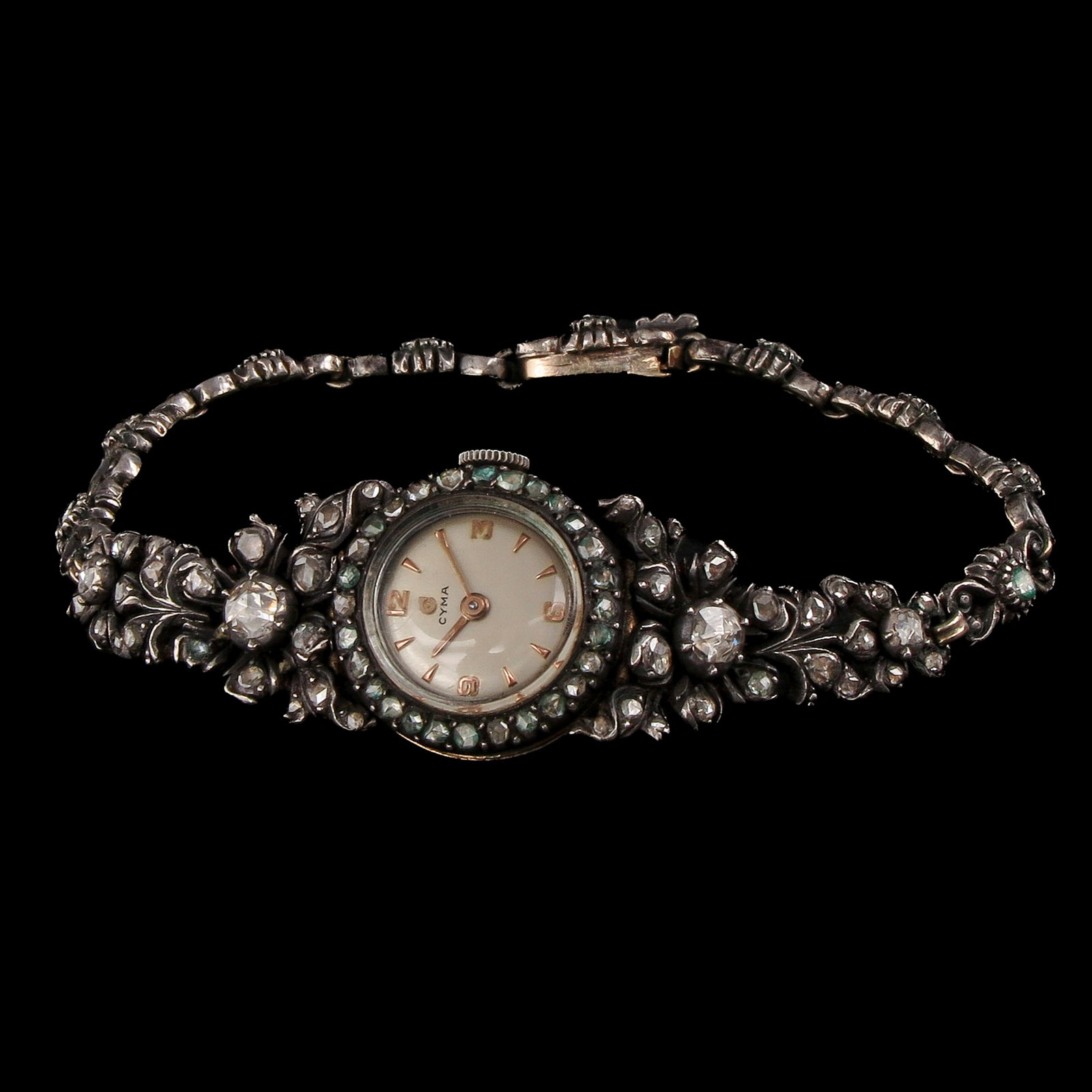 A 19th Century Cyma Watch with Diamonds: 19th century, by Cyma, gold on silver, set with rose-cut diamonds, the largest approximately 4 mm, length 17 cm.
