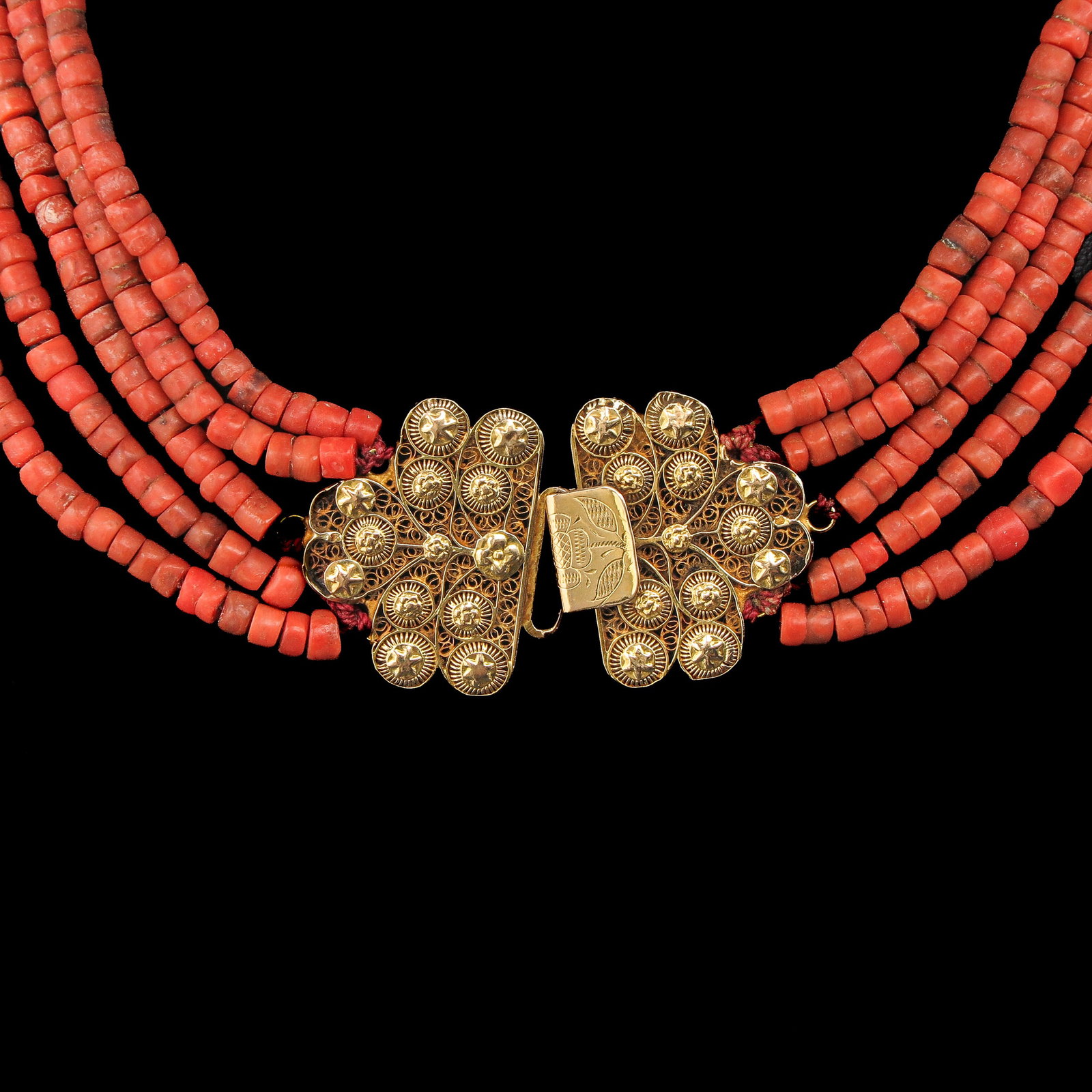 A 19th Century Red Coral Necklace: With 5 rows of red coral, 19th century, 14-karat gold clasp, bead diameter 4 mm, weight 80 grams.