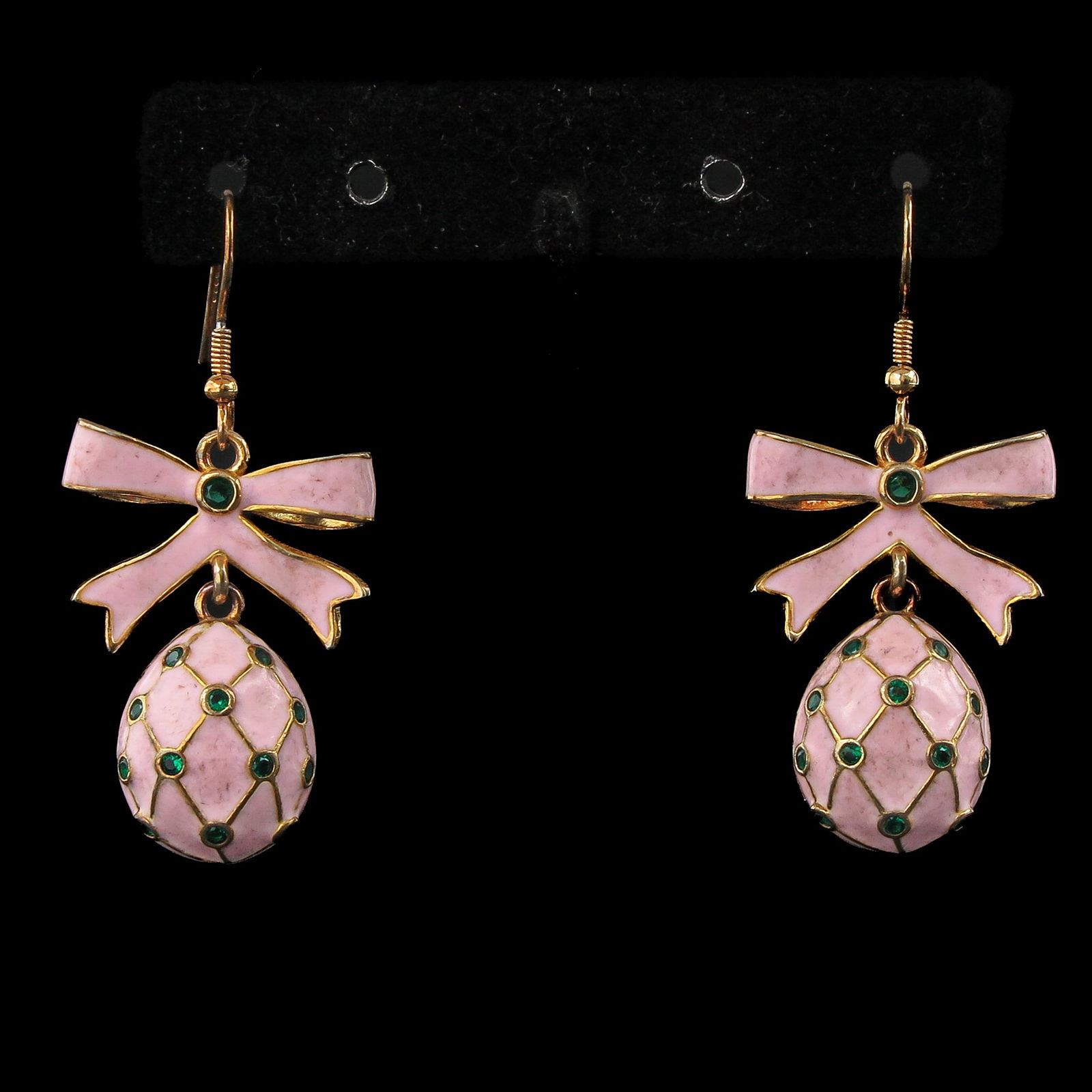 A Pair of Earrings: Enameled earrings set with stones, in the shape of an egg with a bow, length 33 mm.