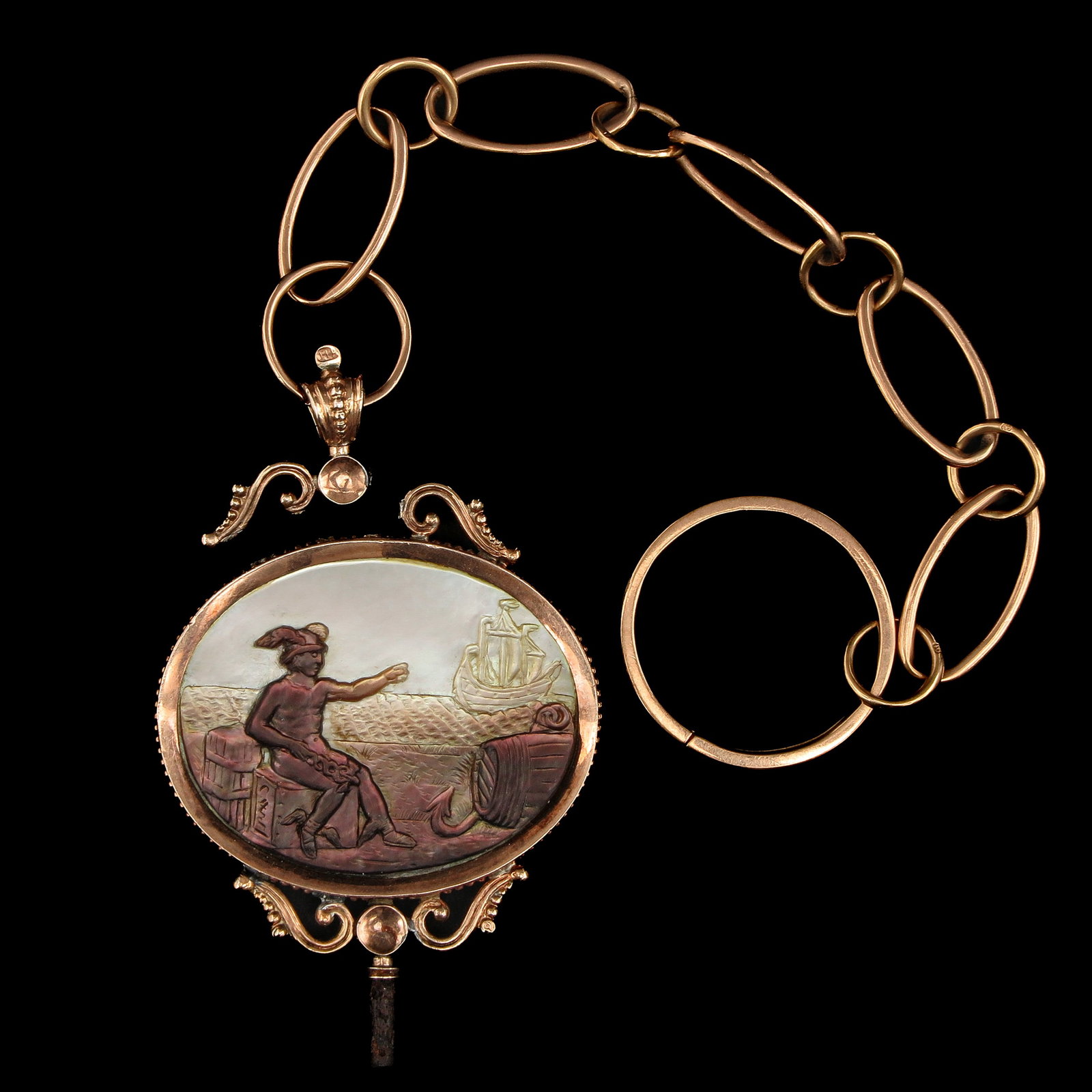A 9KG Watch Chain: 9-karat gold, with two plaques depicting a harbor and a seascape, very finely carved, ca. 1820–1840, length 23 cm. Small break in the holder.