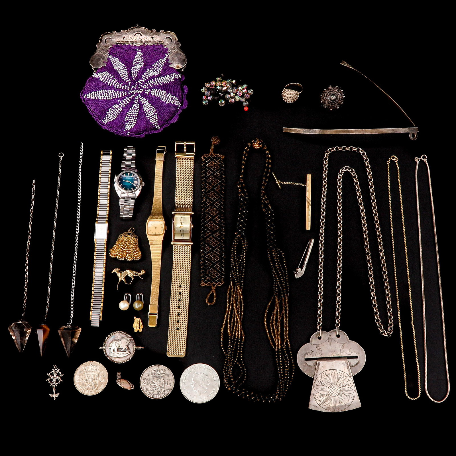 A Dverse Group of Jewelry: Various jewelry, including watches and silver coins.