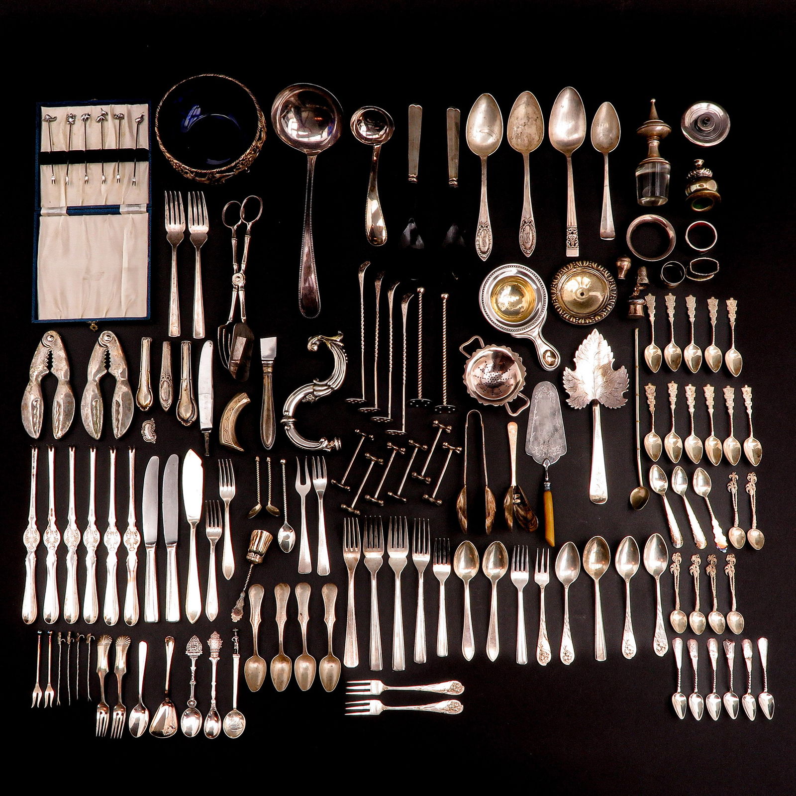 A Diverse Collection of Items: Cutlery and salt cellar, including silver
