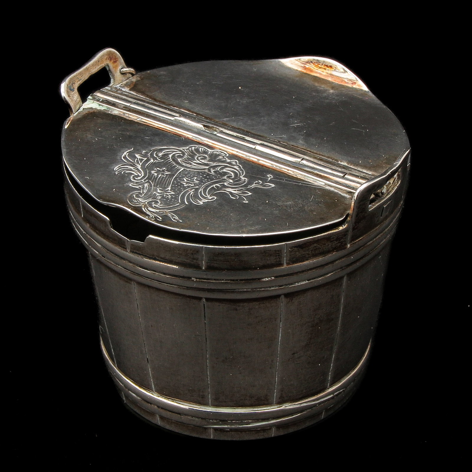 A Mustard Pot: Possibly 18th century, gilded interior, Sweden, with engraved family crest, height 55 mm.