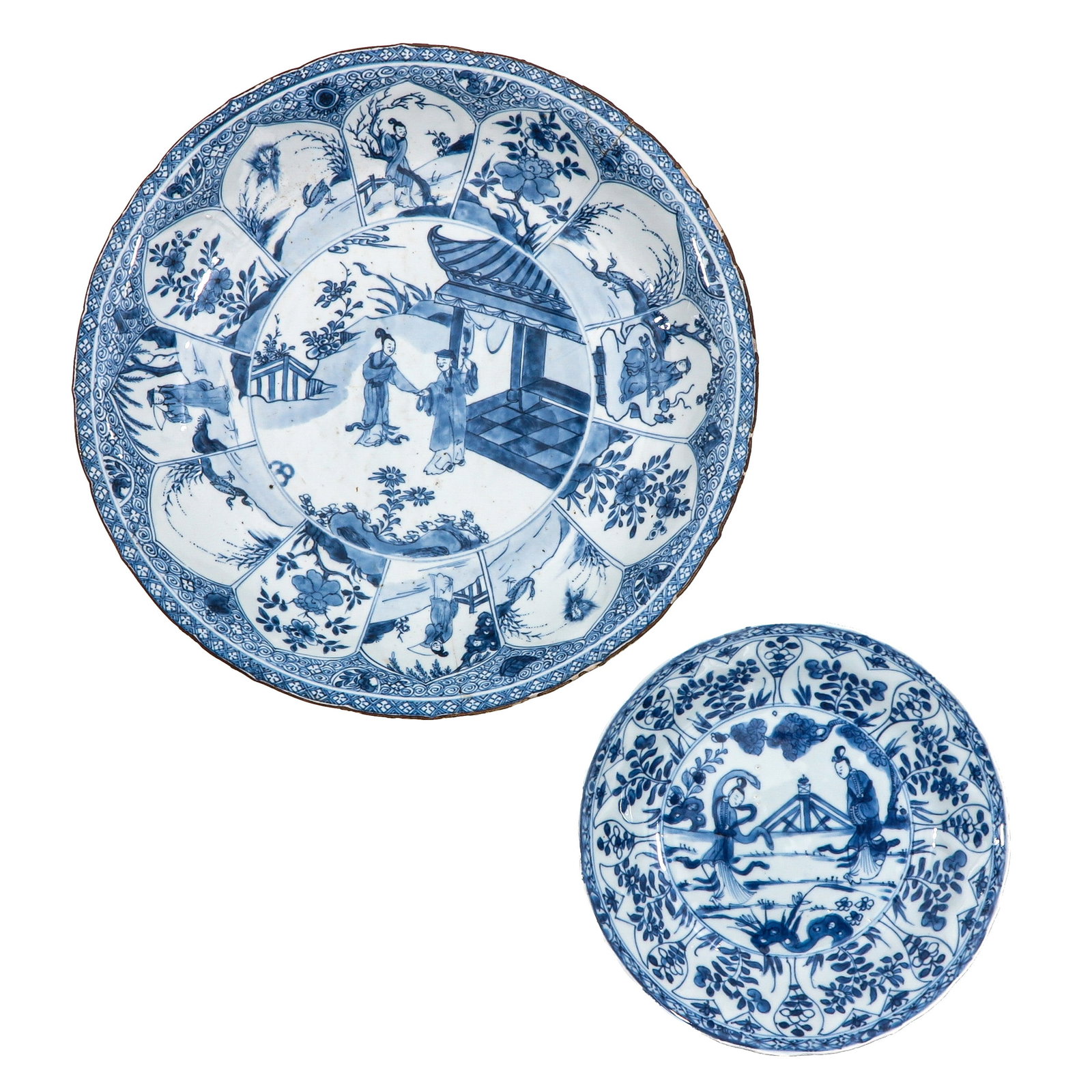 A Lot of 2 Blue and White Plates: Including a charger and plate, charger measures 35 cm. in diameter, depicting garden scenes with Chinese figures, in diverse conditions.