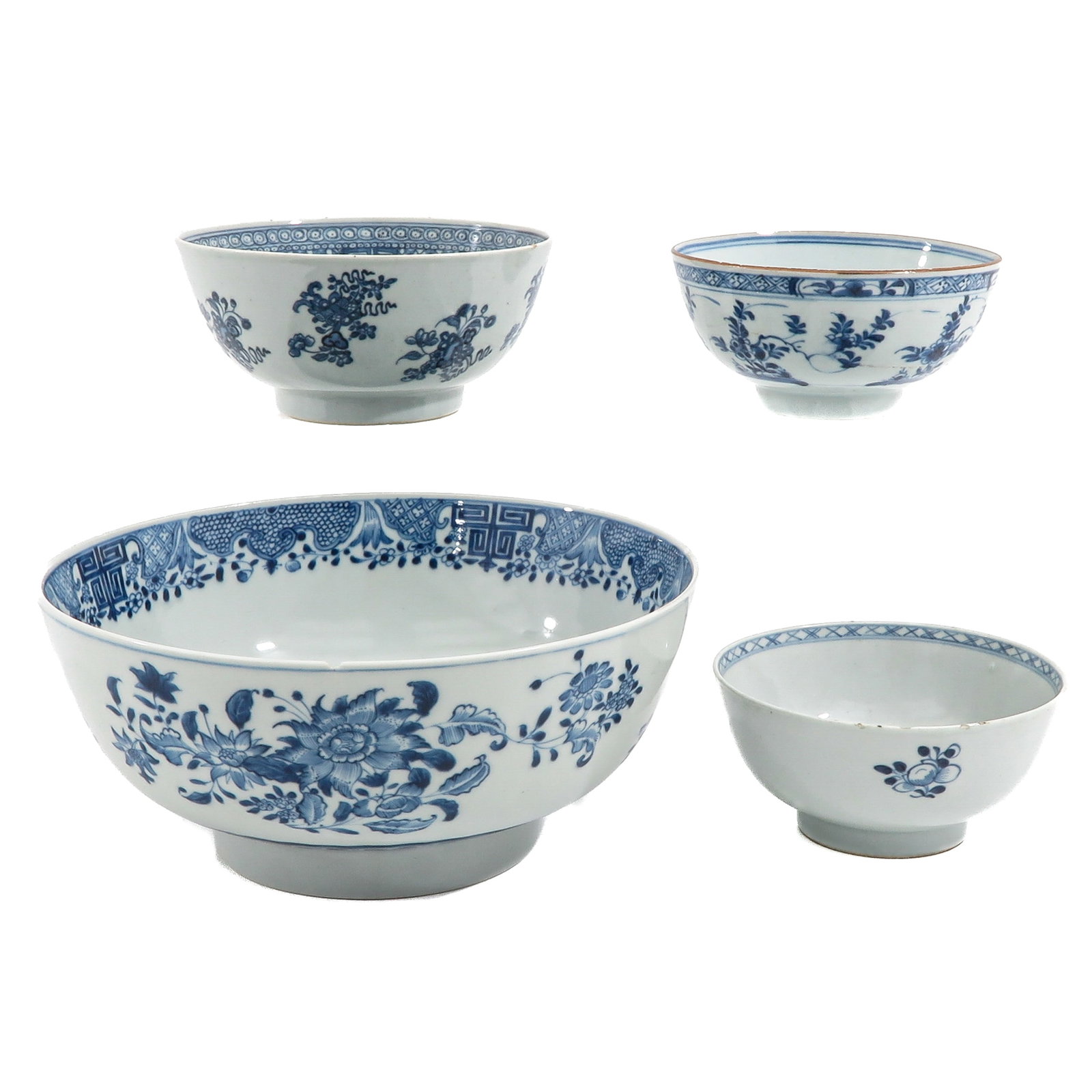 A Group of 4 Blue and White Bowls: In a variety of decors and sizes, including 18th Century, largest bowl is 26 cm. in diameter, in diverse conditions.
