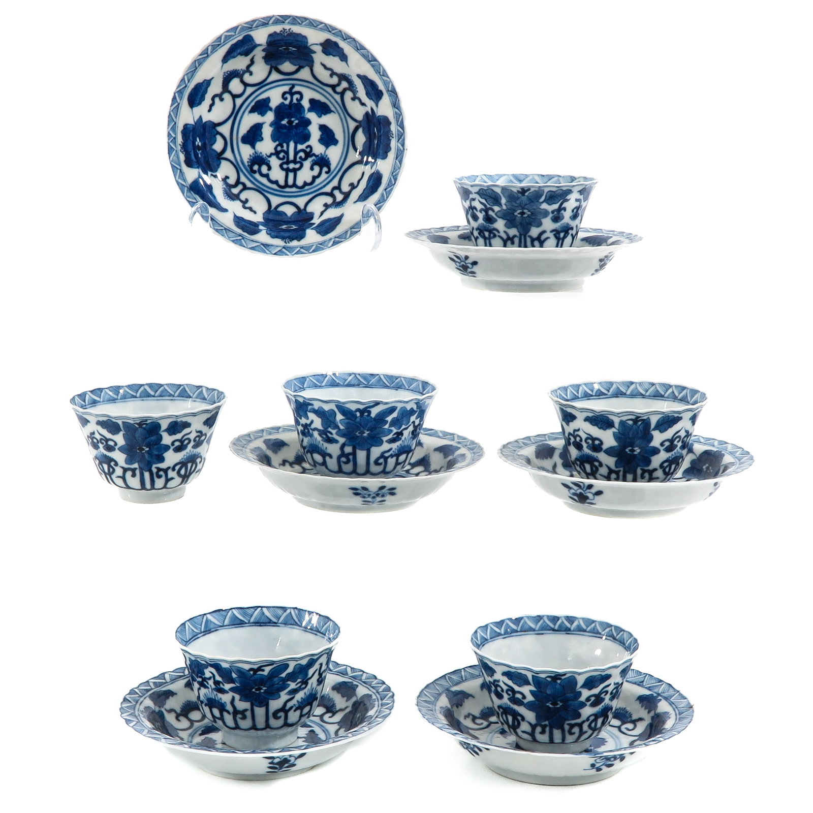 A Series of 6 Cups and Saucers: Blue and white floral decor, Kangxi mark, saucers are 13 cm. in diameter.