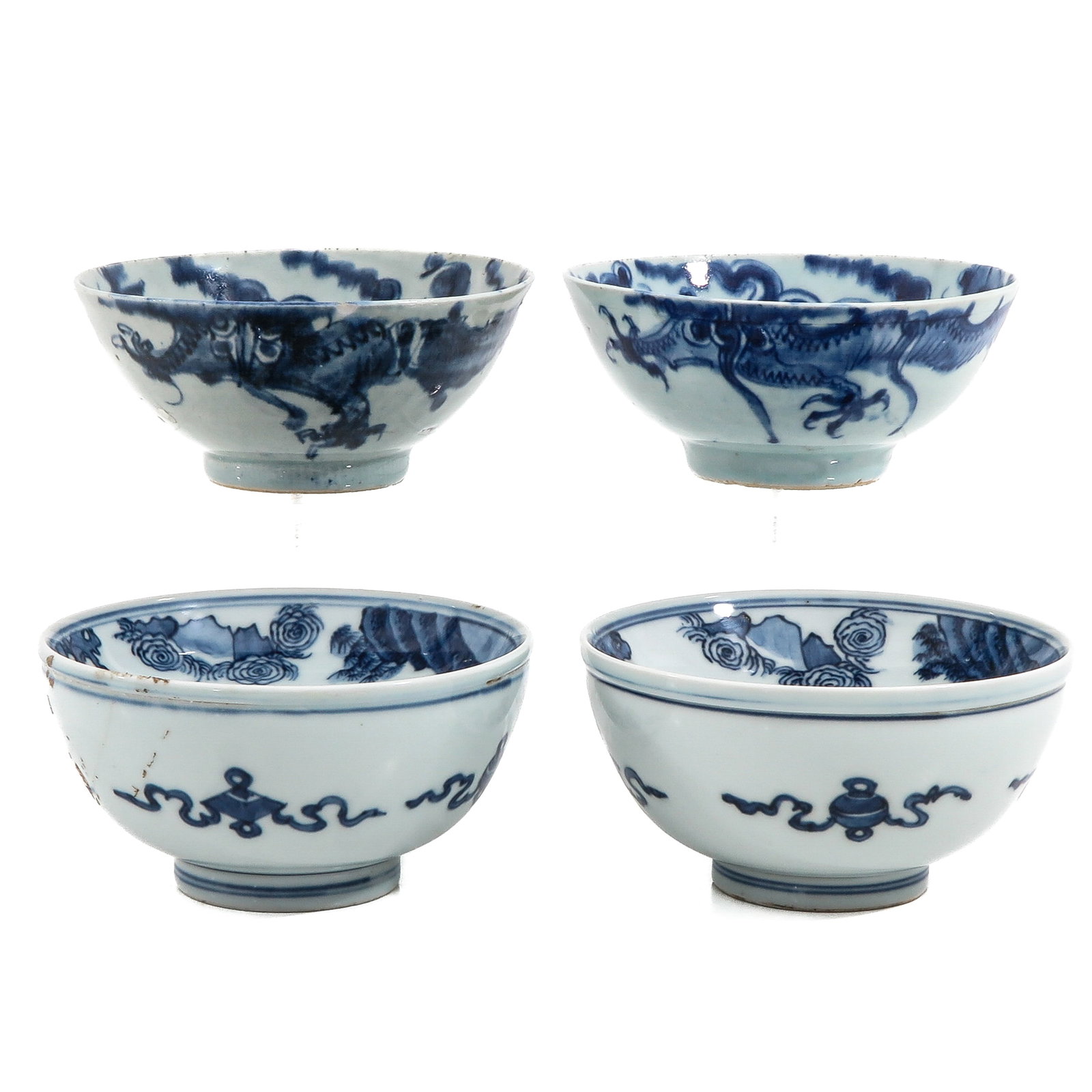 A Group of 4 Blue and White Bowls: In a variety of decors, including 19th / 20th Century, largest bowl is 15 cm. in diameter, in diverse conditions.