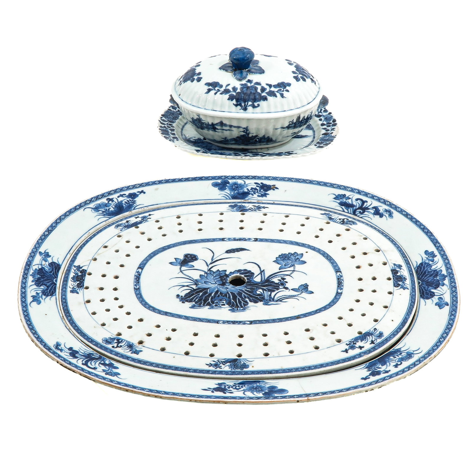 A Tureen with Cover and Strainer: Incluidng underplate and tray, circa 1800, tray is 45 cm. long, in diverse conditions.