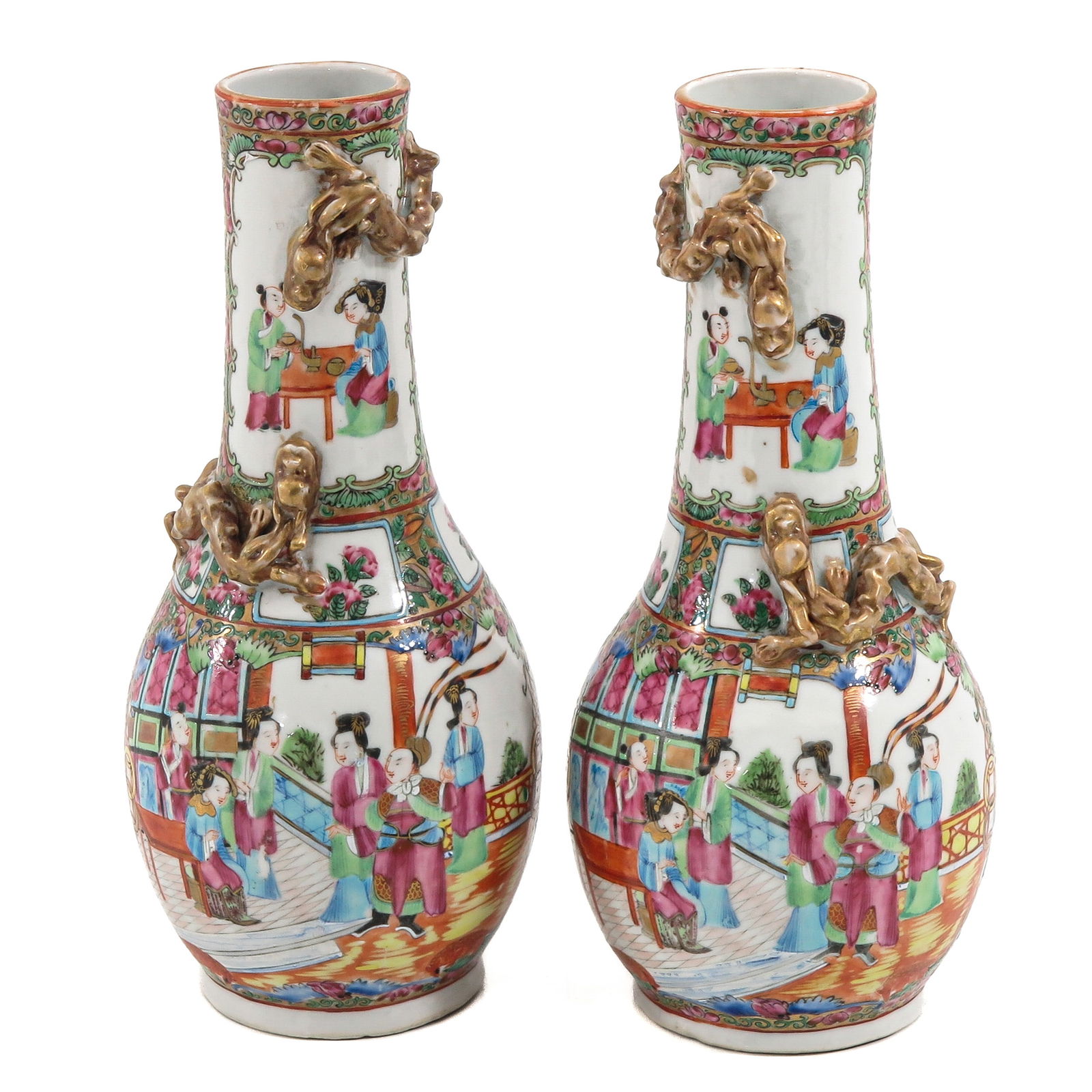 A Pair of Cantonese Vases: Decorated with flowers and birds, 24 cm. tall.