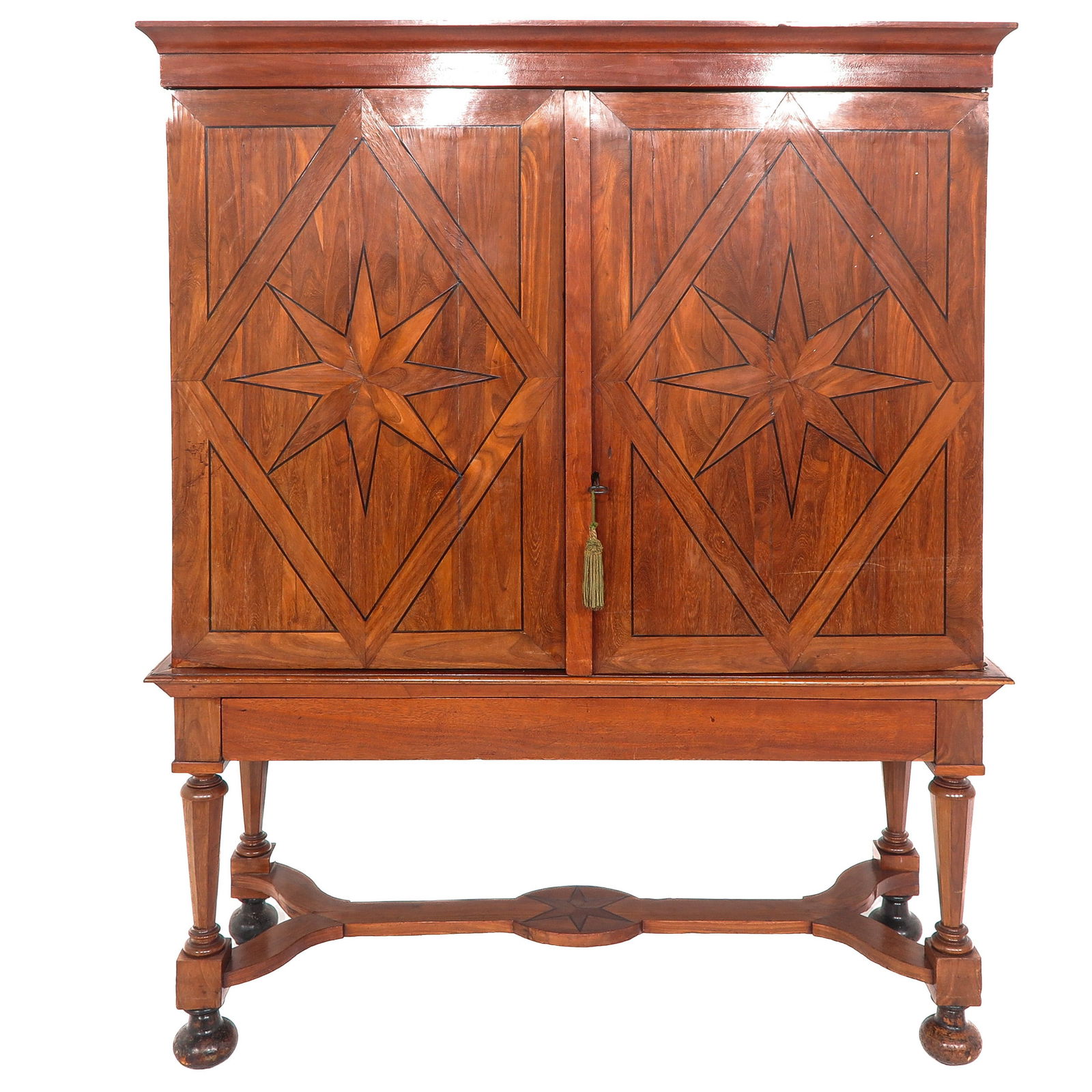 A Cross-Foot Cabinet: With panel doors featuring star inlays, on turned legs with a shaped rail, 162 x 198 x 58 cm.