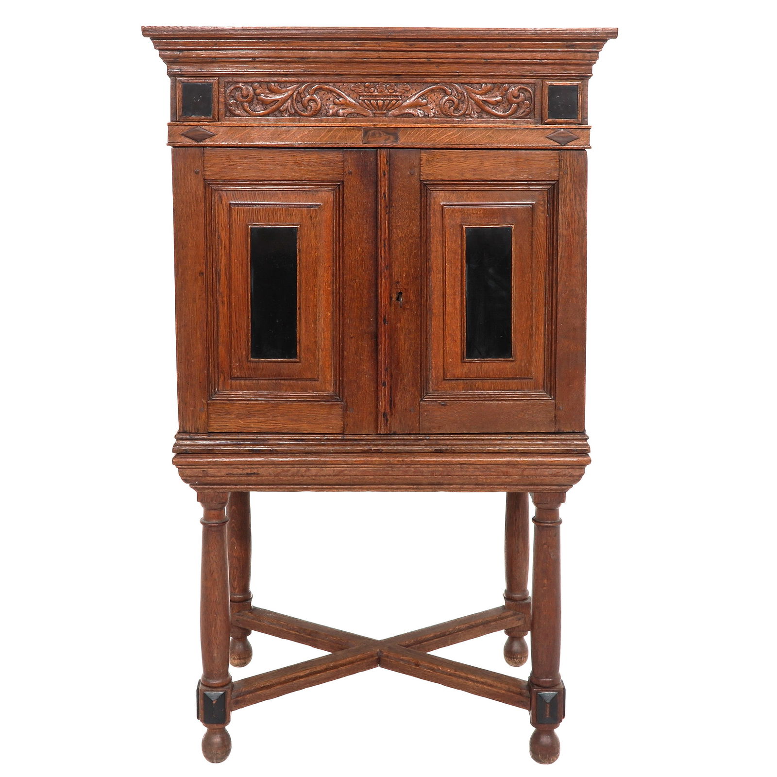 A Cross-Foot Cabinet: Oak veneered with walnut, with 2 doors, 93 x 157 x 63 cm.