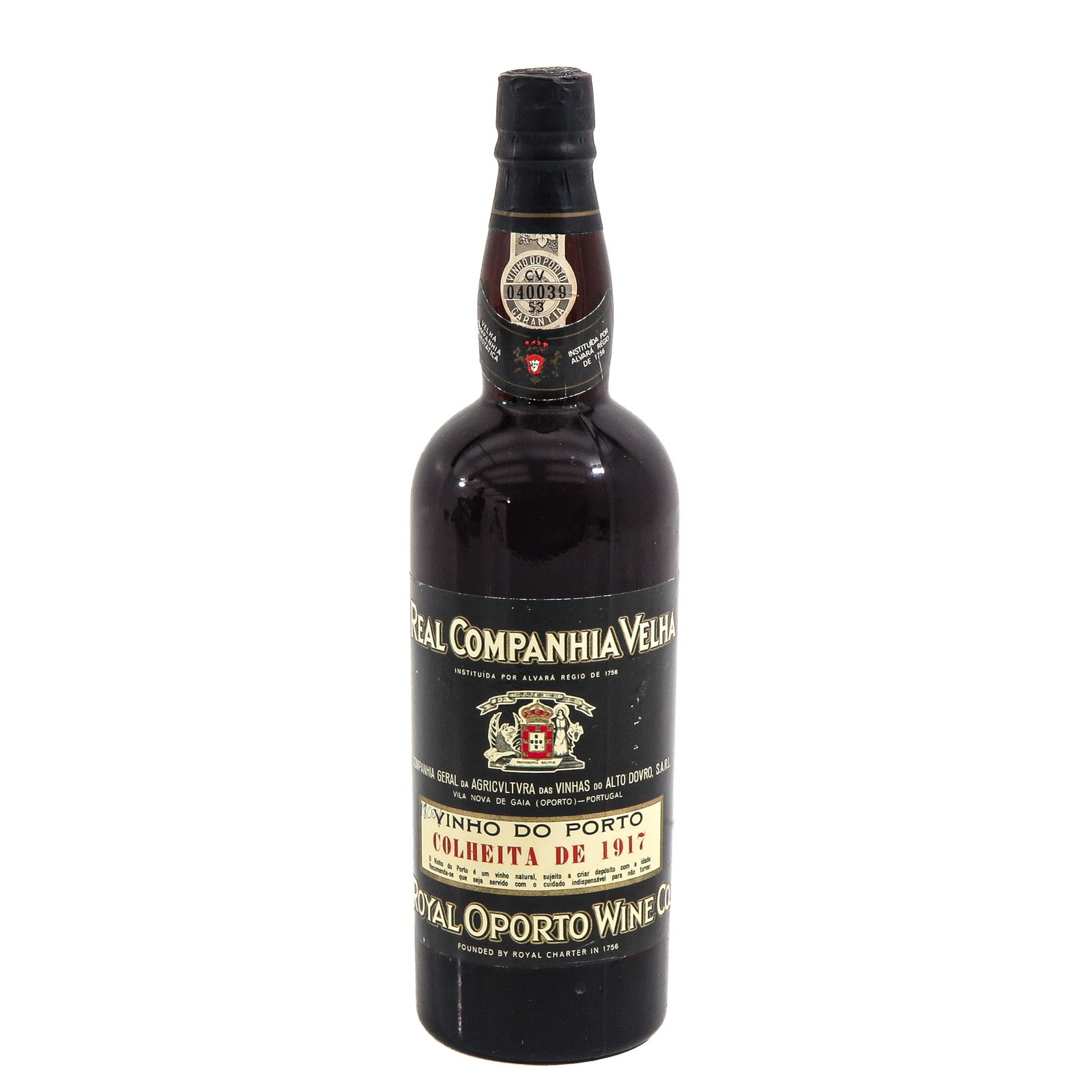 A Bottle of Port: Port, Royal Oporto Wine Co., Vinho do Porto, Colheita de 1917, the label states "Real Companhia Velha" and features the Portuguese coat of arms, height 30 cm.