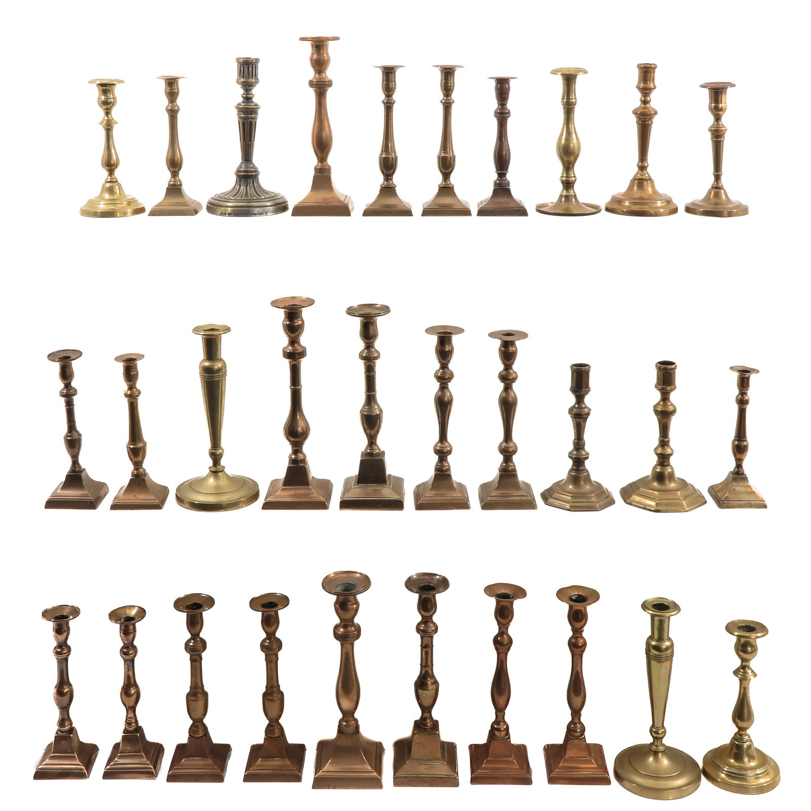 A Group of 30 Candlesticks: Consisting of 30 candlesticks in various sizes and styles, 19th century, height 29 cm.
