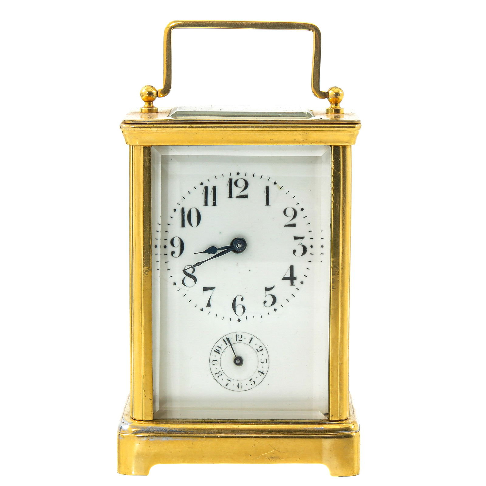 A Travel Clock: With a white enameled dial with Roman numerals, with original travel case, height 14 cm (handle up)