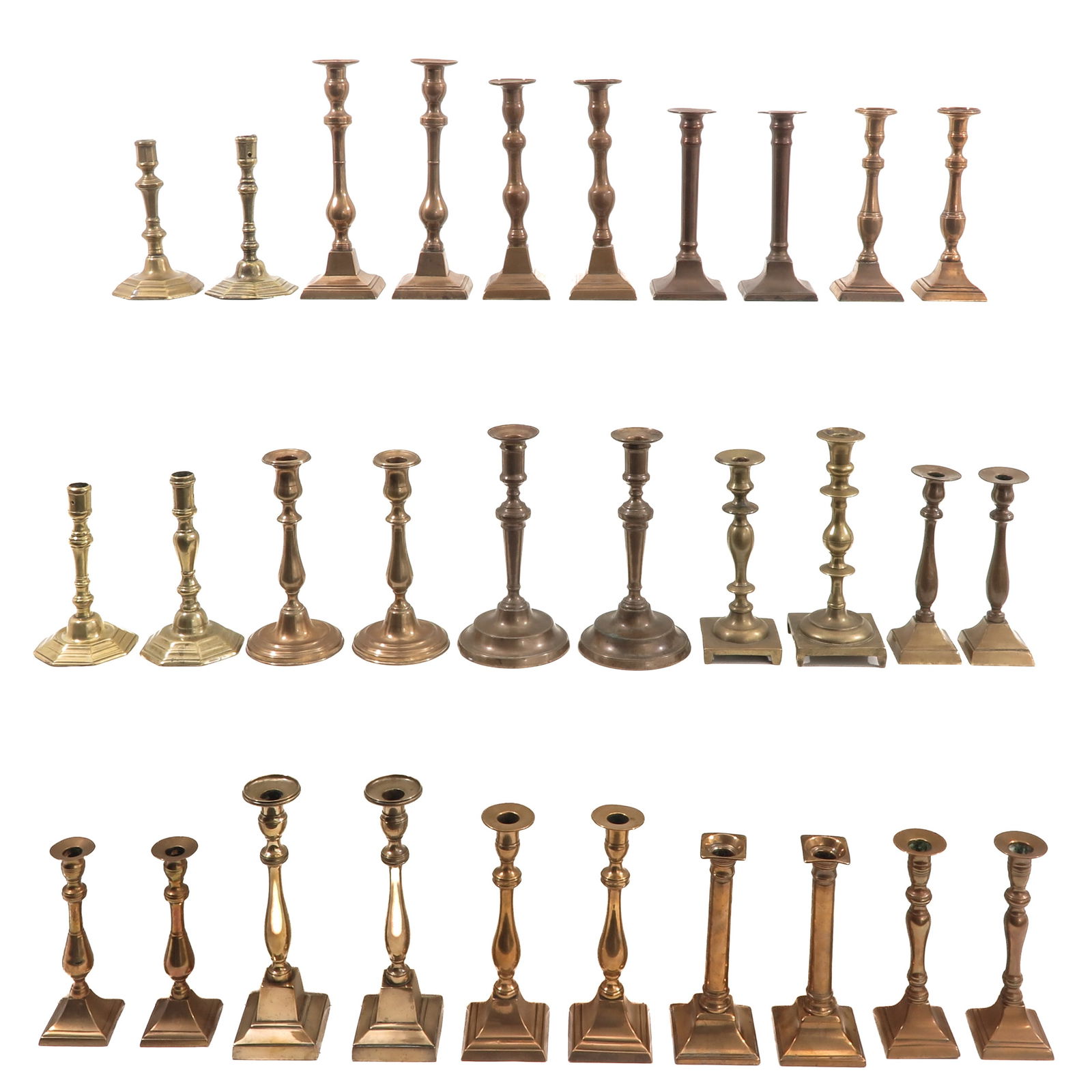 A Group of 30 Candlesticks: Consisting of 30 candlesticks in various sizes and styles, 19th century, tallest 28 cm.