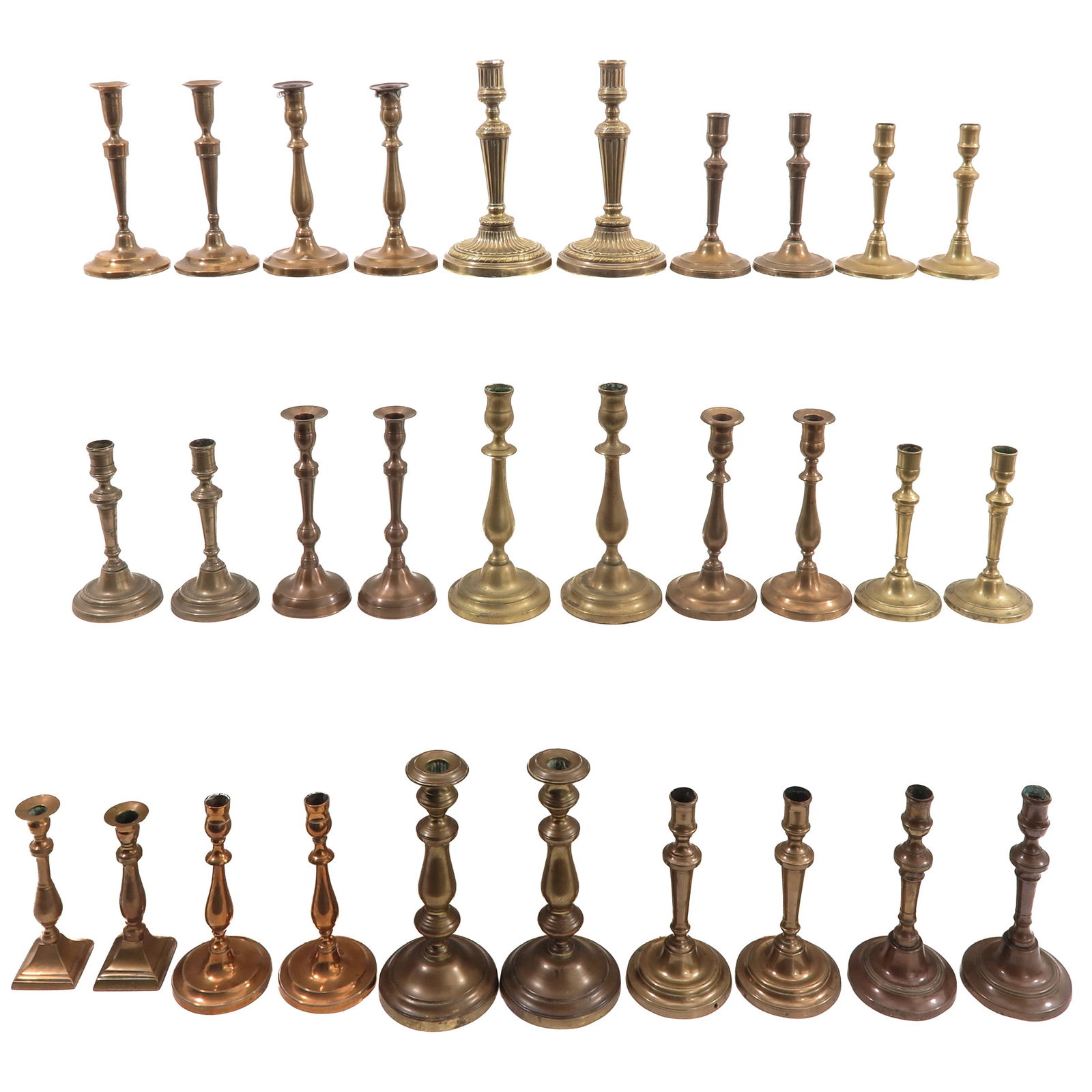 A Group of 30 Candlesticks: Consisting of 30 candlesticks in various sizes and styles, 19th century, tallest 29 cm.