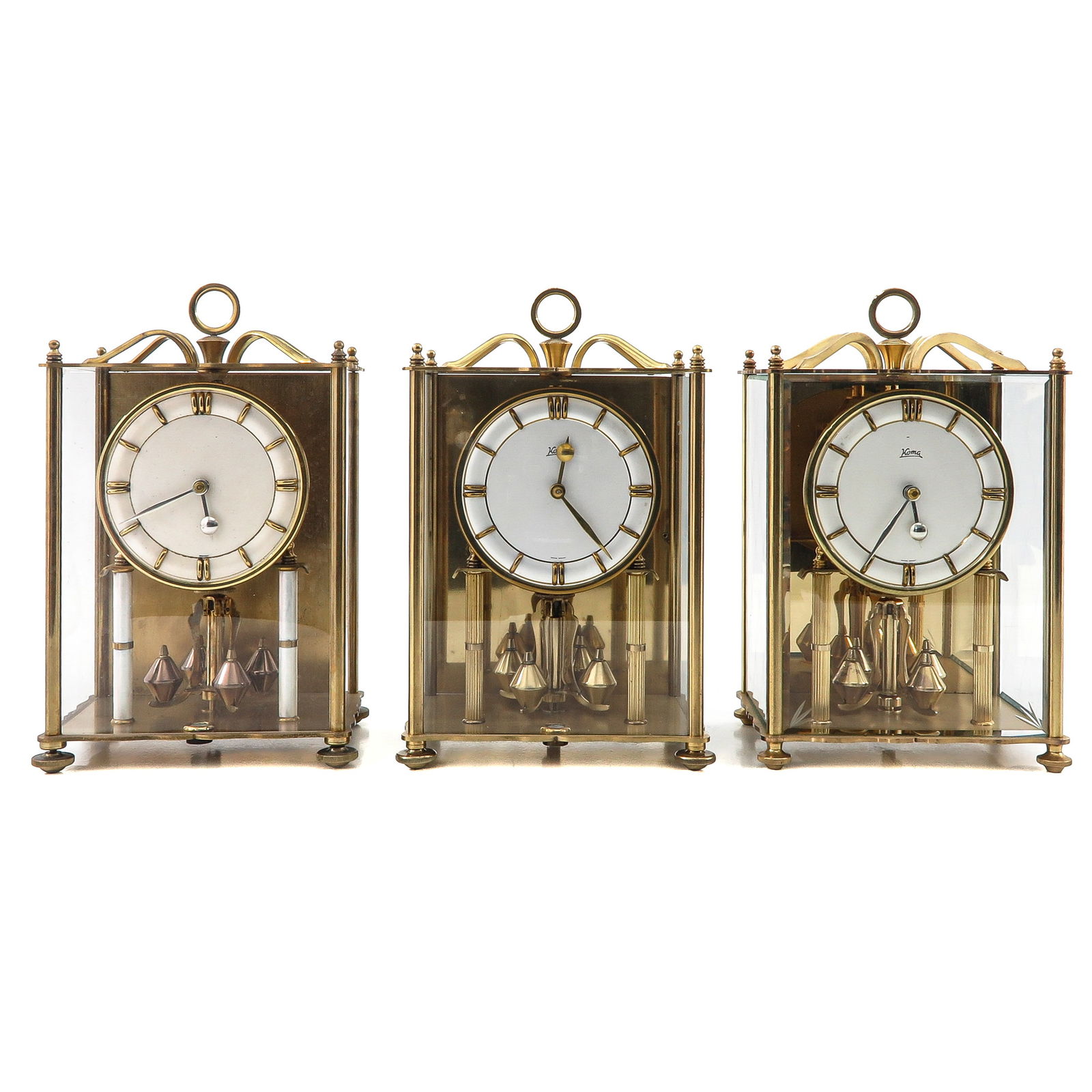 A Group of 3 Table Clocks: Consisting of 3 table clocks, including Koma, height 26 cm.