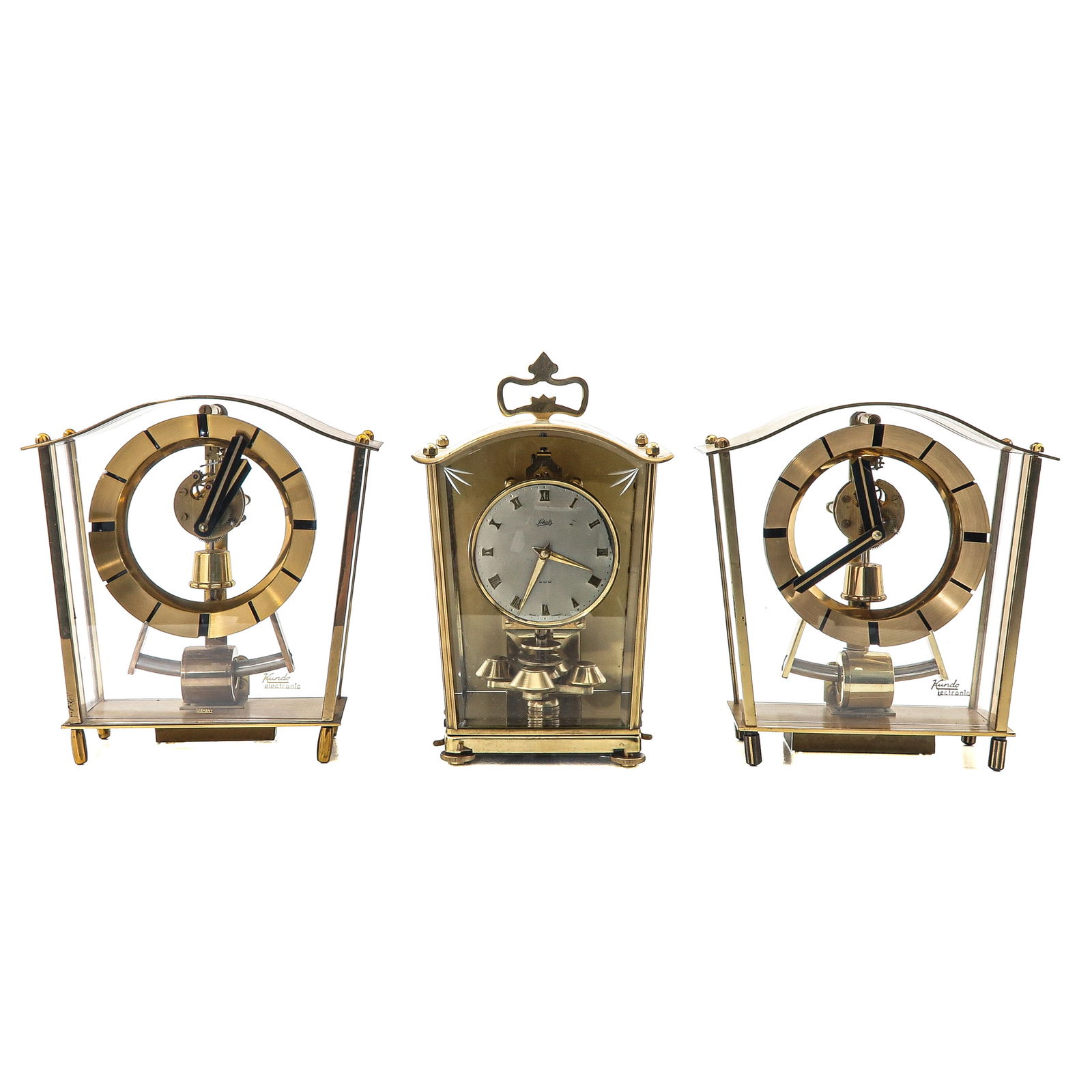 A Group of 3 Table Clocks: Consisting of 3 table clocks, including one signed "Schatz," height 21 cm.