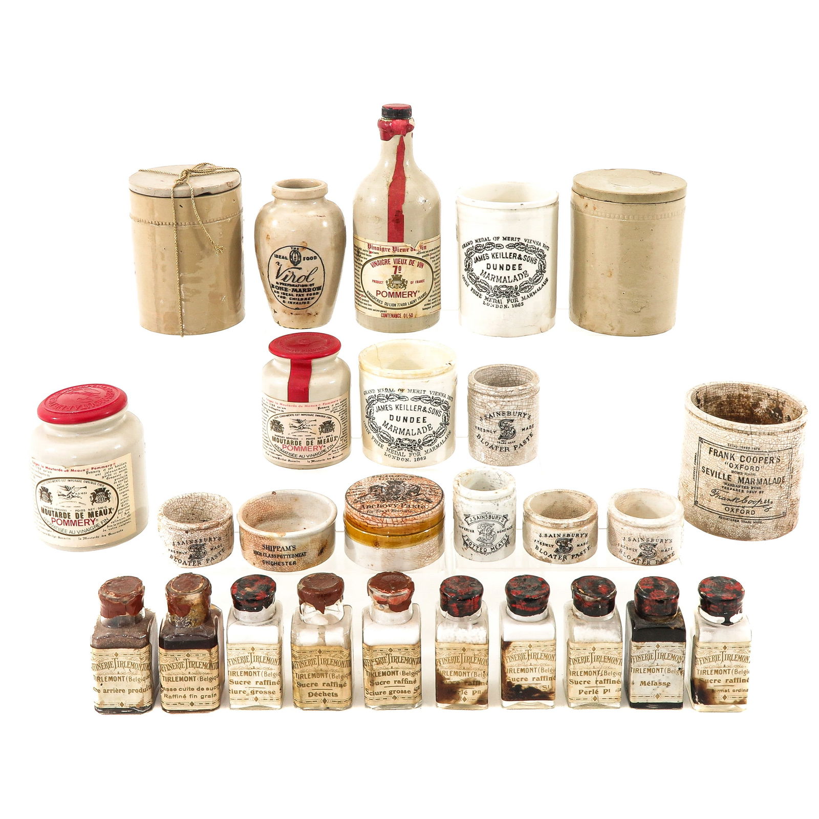 A Group of Jars and Bottles: Consisting of various ceramic and glass jars and bottles, some with inscriptions and labels, height 22 cm.