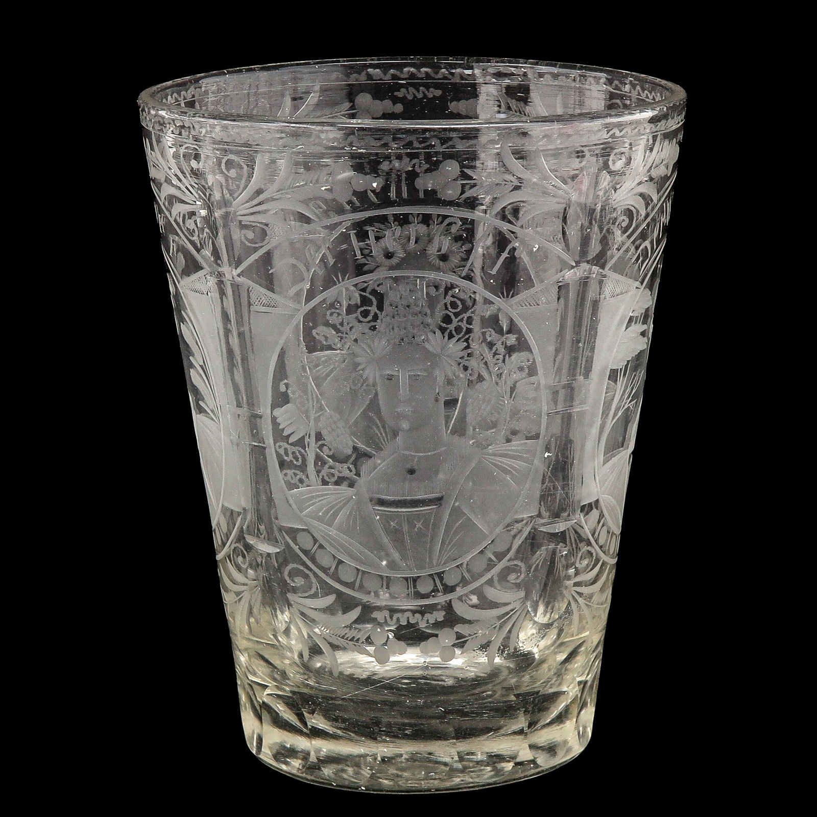 An Engraved Glass or Spoelglas: Engraved with depictions of the four seasons, 18th century, height 15 cm.
