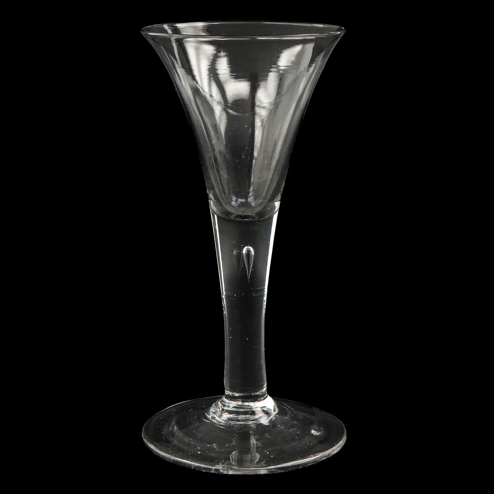 An 18th Century Wine Glass: 18th century, so-called tear glass, height 21 cm.