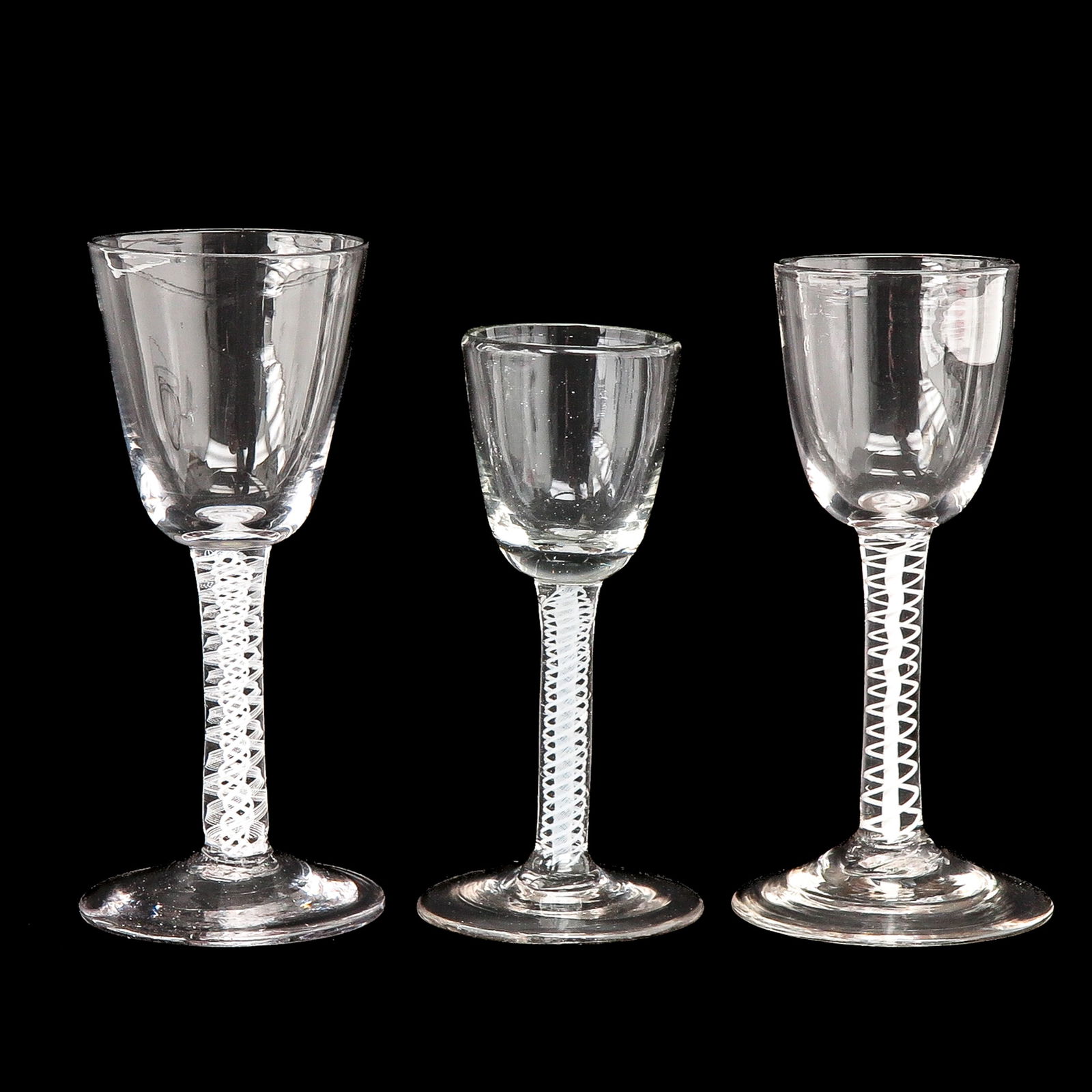 A Set of 3 Slinger Glasses: With 3 pendulum glasses, height 13 cm.