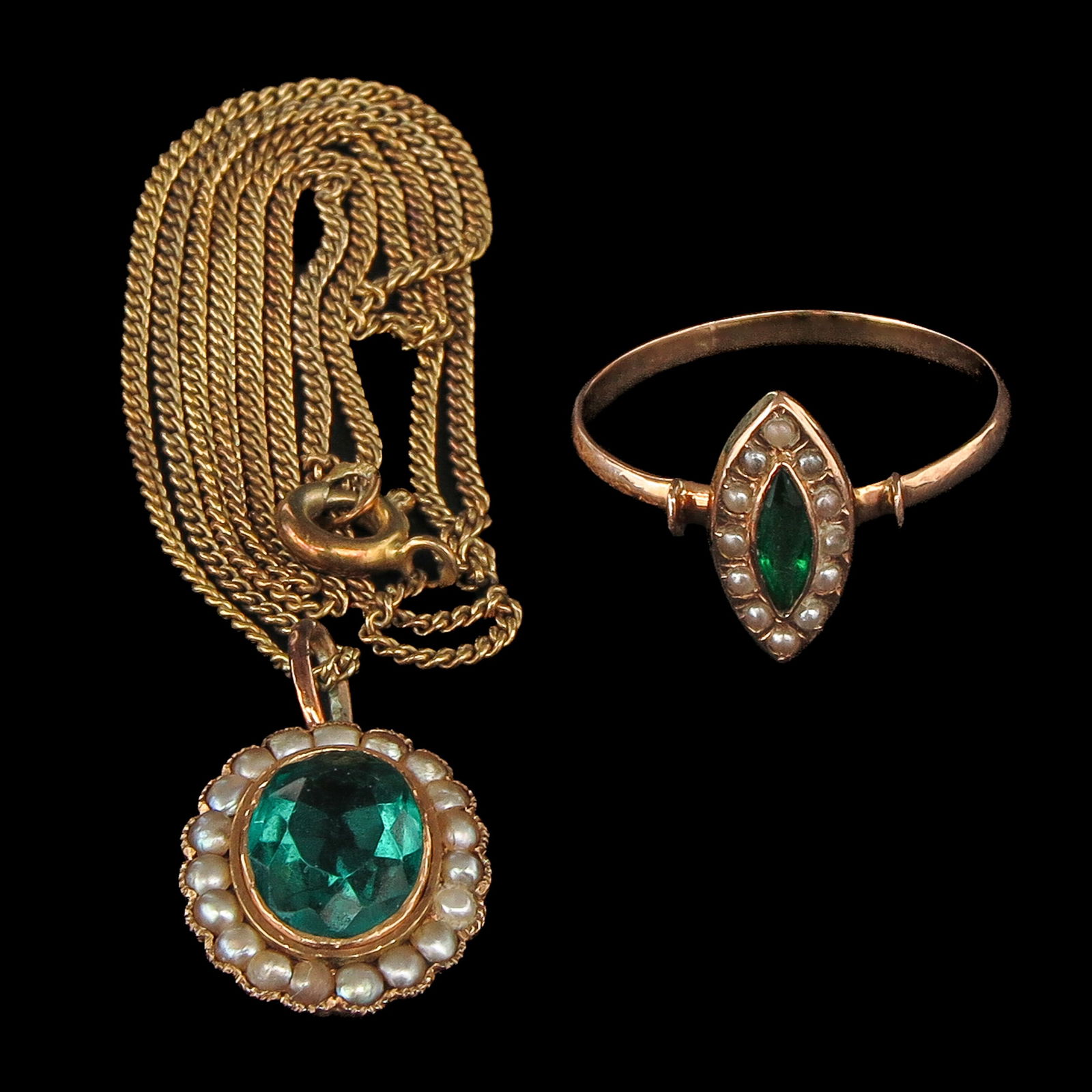 A Ring and Necklace: Consisting of a necklace set with green stone and seed pearls and a 14-karat gold ring, ring size 17