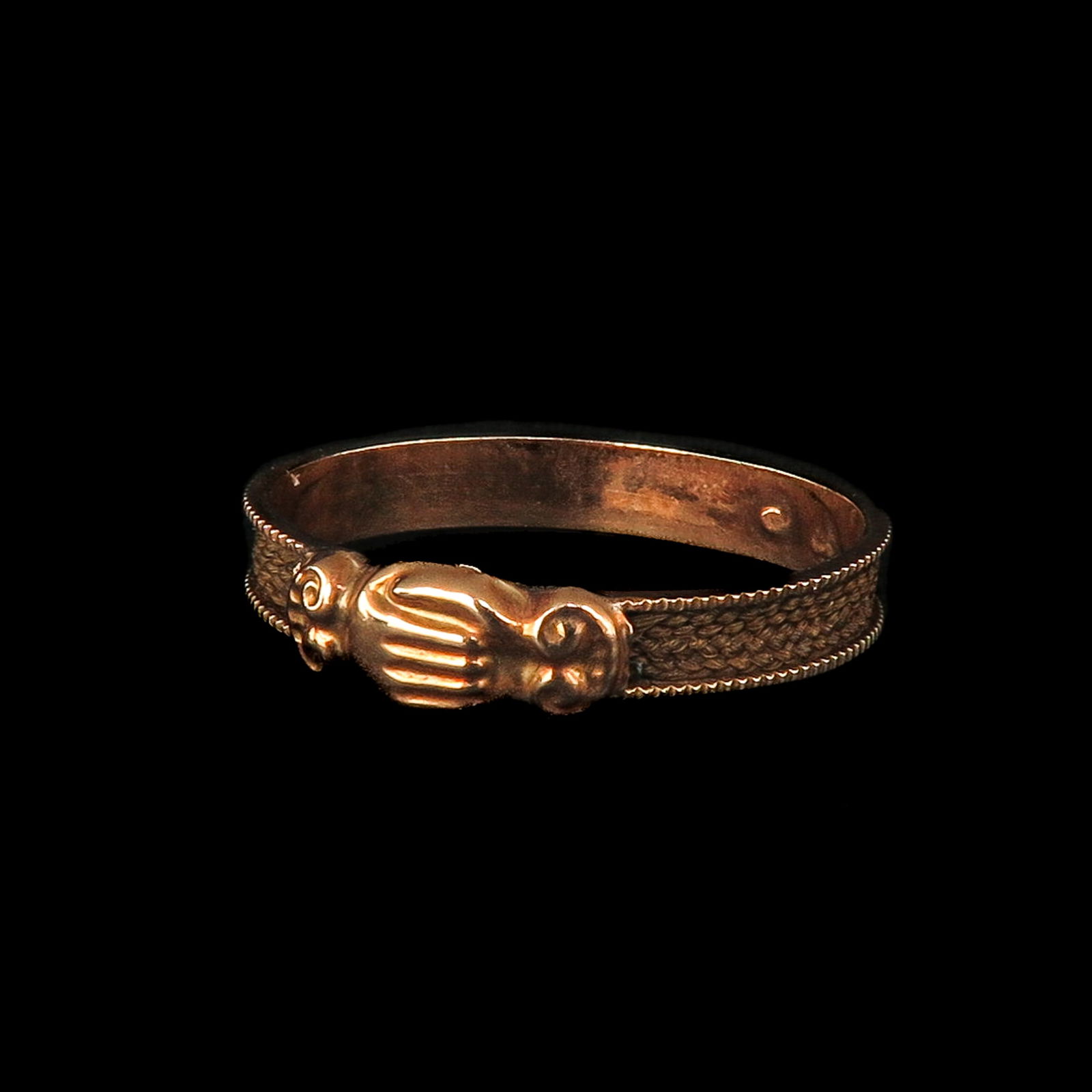 A Memorial Ring: Gold, with hair work, ring size 19