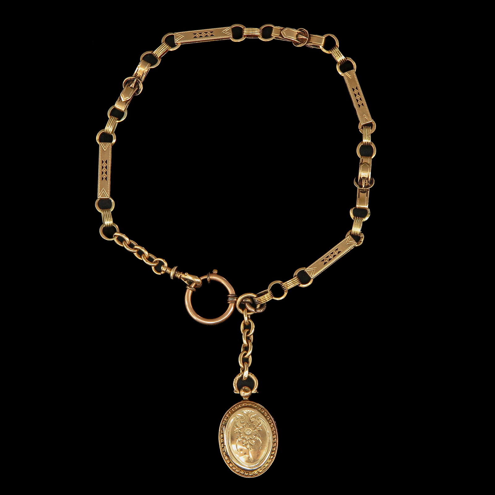 A Pocket Watch Chain: Gold, with locket, length 30 cm.