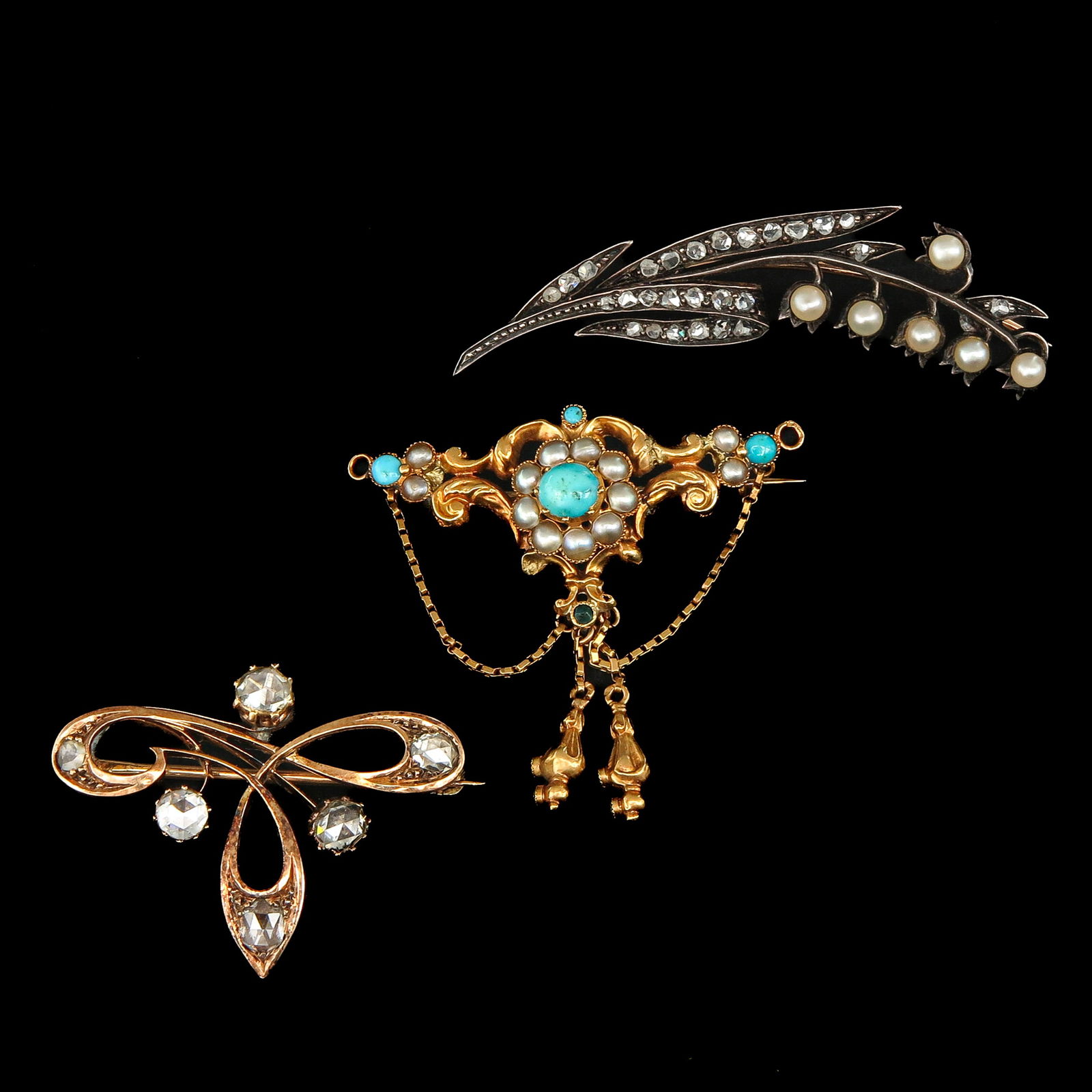 A Group of 3 Brooches: Consisting of three brooches, including an Art Nouveau pearl and diamond brooch, and a lily of the valley, length 52 mm.