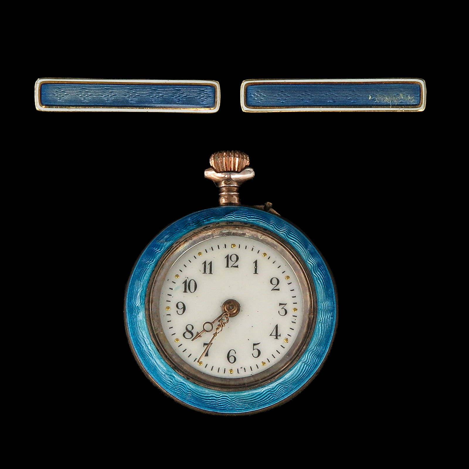 A Pocket Watch and 2 Bar Pins: Consisting of a pocket watch and a pair of pins, blue enamel and guilloche, diameter 39 mm.