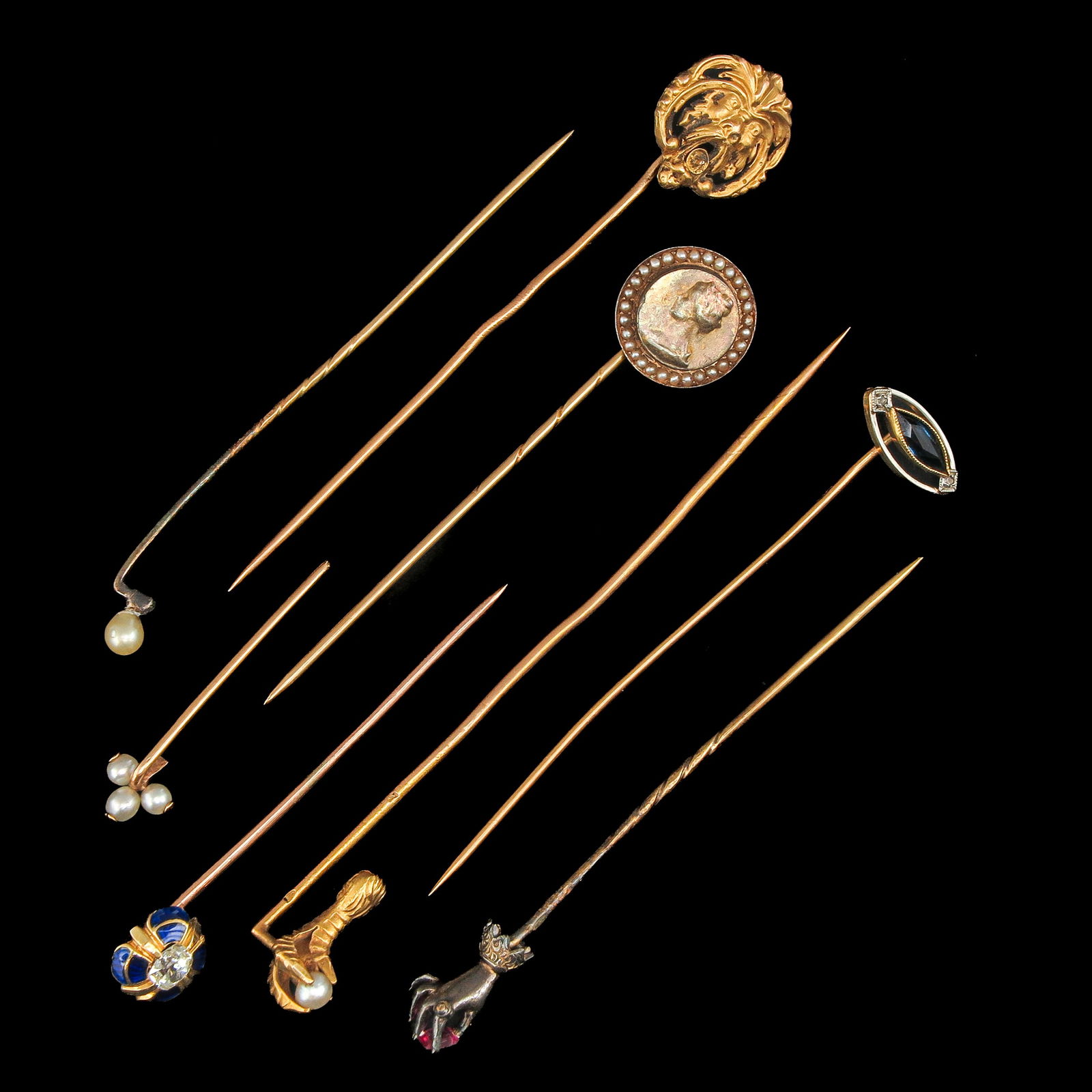 A Group of Stick Pins: Consisting of 8 assorted stick pins, including gold and diamonds