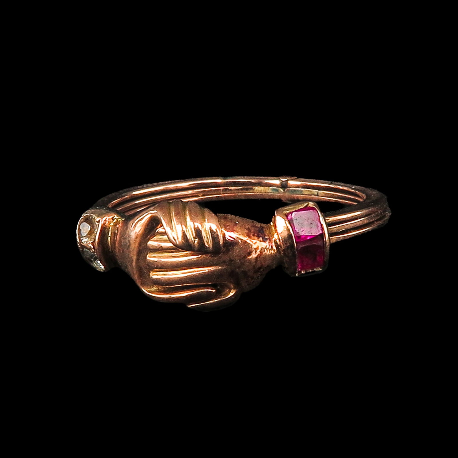 Gimmel Fede Ring: Victorian period, with joined hands and a hidden heart in the center, set with diamond rubies, ring size 18.