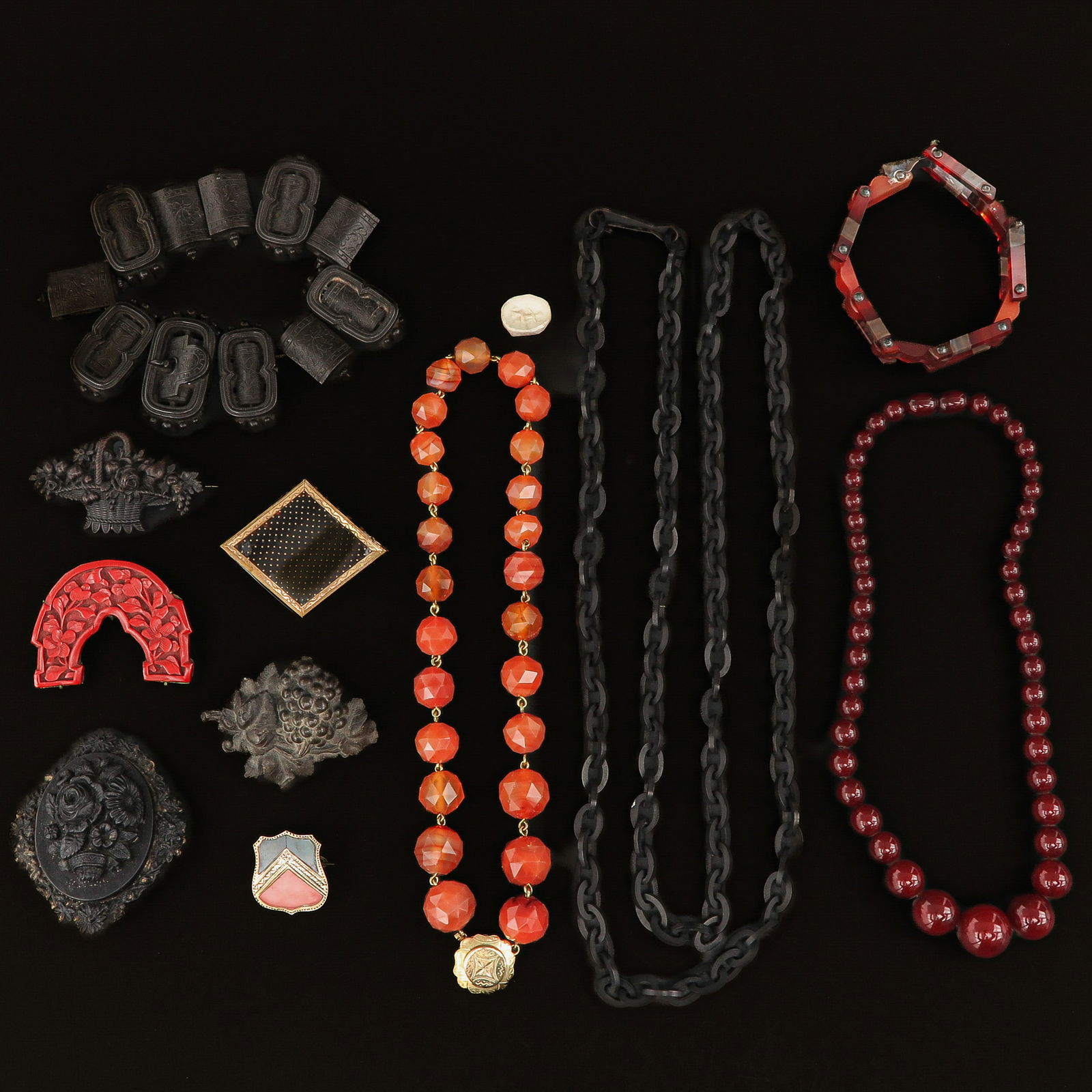 A Diverse Group of Jewelry: Consisting of various agate, wood, and amber jewelry pieces.