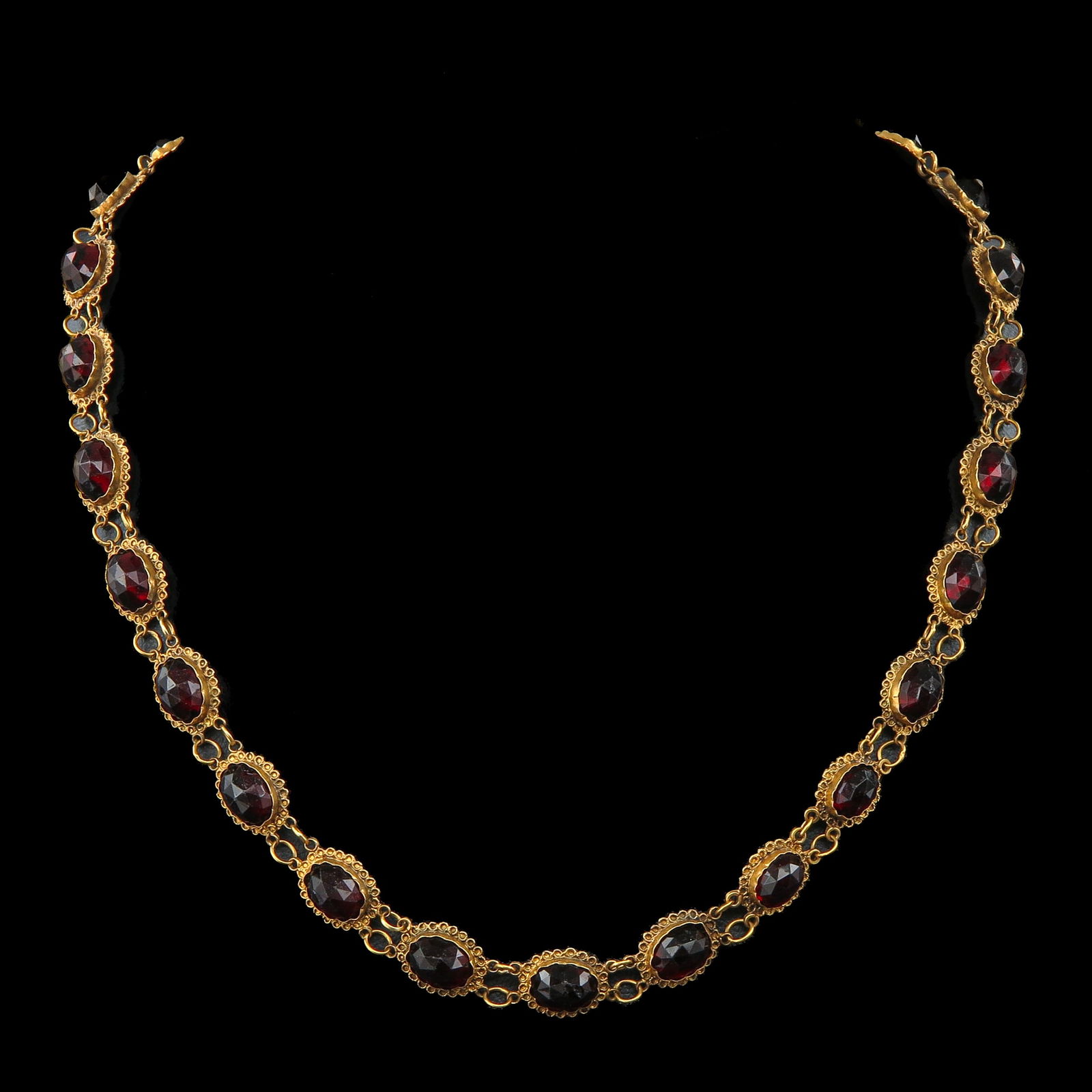 A 19th Century Garnet Necklace: 19th-century gold, set with garnets, length 41 cm.