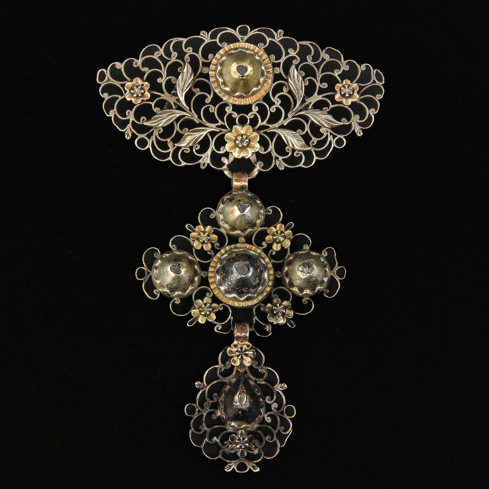 A Large Flemish Brooch Set with Rose Cut Diamonds: Flemish, gold and silver, richly executed in open filigree, set with rose-cut diamonds, length 8.5 cm.