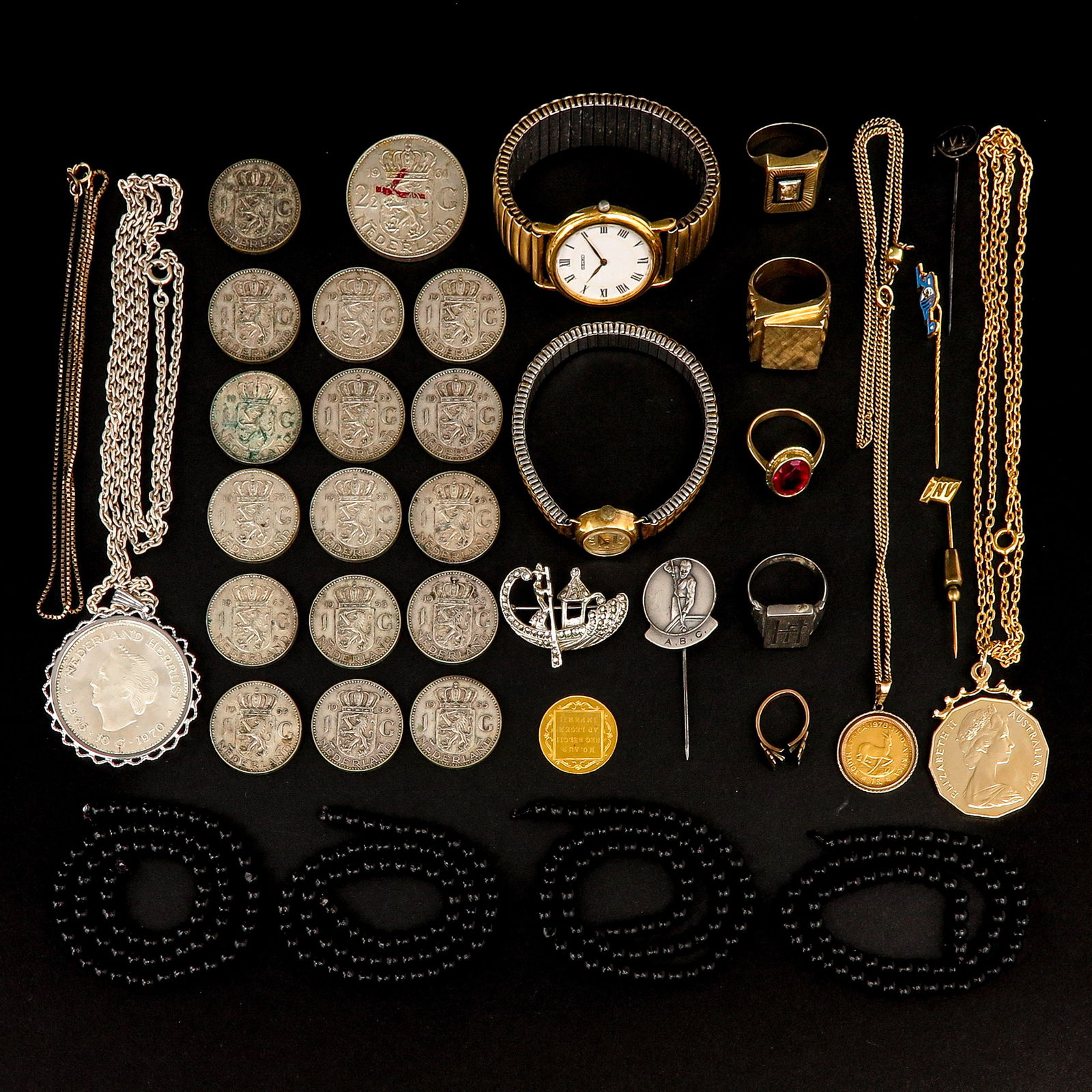 A Diverse Collection of Items: Consisting of silver coins and various jewelry, including 9-karat gold. and 14-karat gold