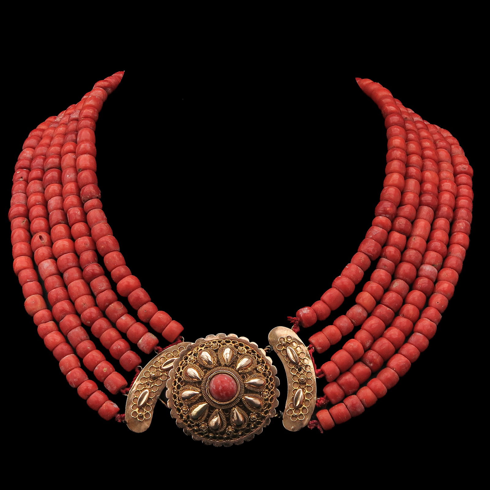 A 5 Strand Red Coral Necklaces: With 5 rows of red coral, 19th century, Walcheren, 14-karat gold clasp set with precious coral, diameter 36 mm, bead diameter 8-9 mm, weight 191 grams.