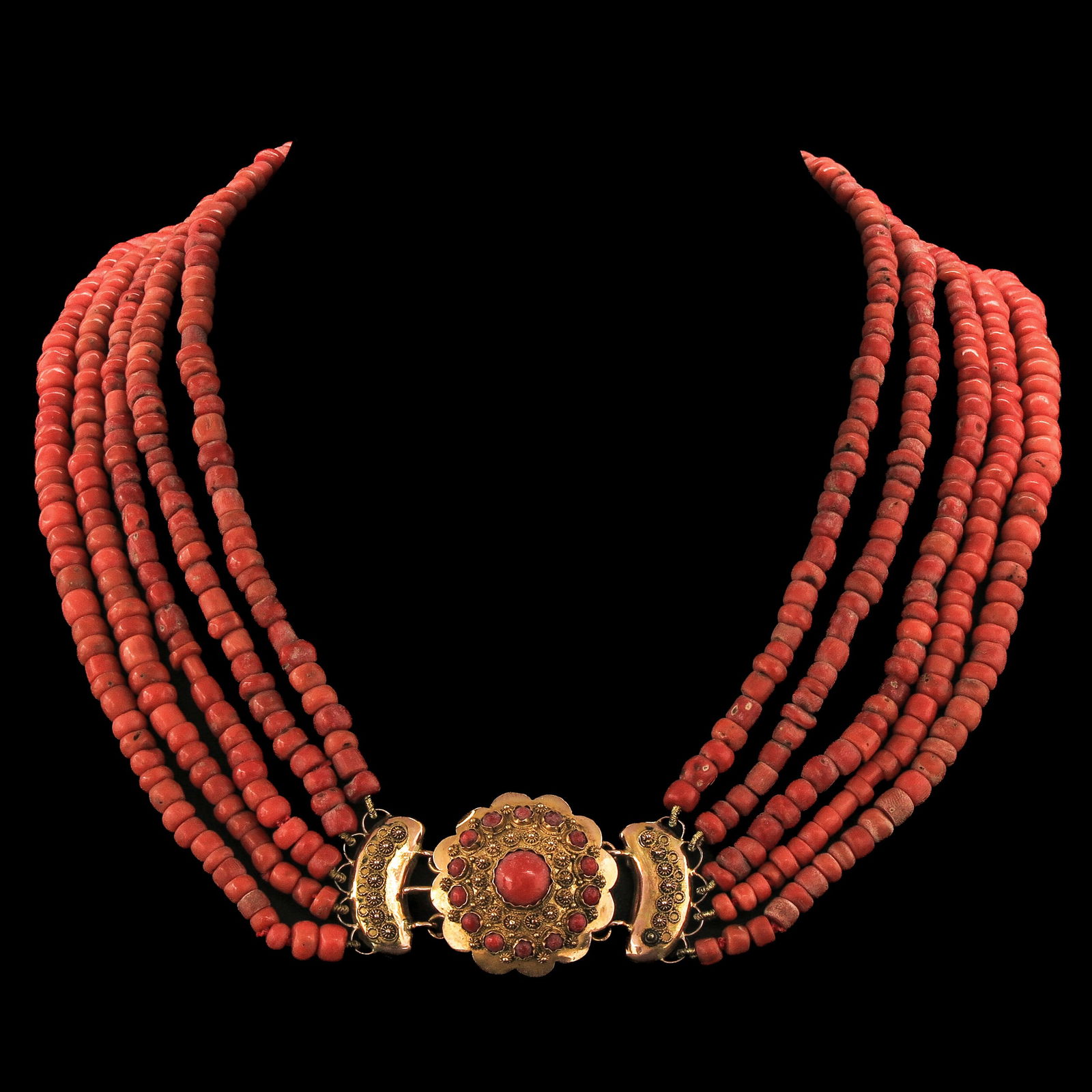 A 5 Strand Red Coral Necklace: With 5 rows of red coral, 19th century, Walcheren, 14-karat gold clasp set with precious coral, diameter 28 mm, bead diameter 5-7 mm, weight 127 grams.