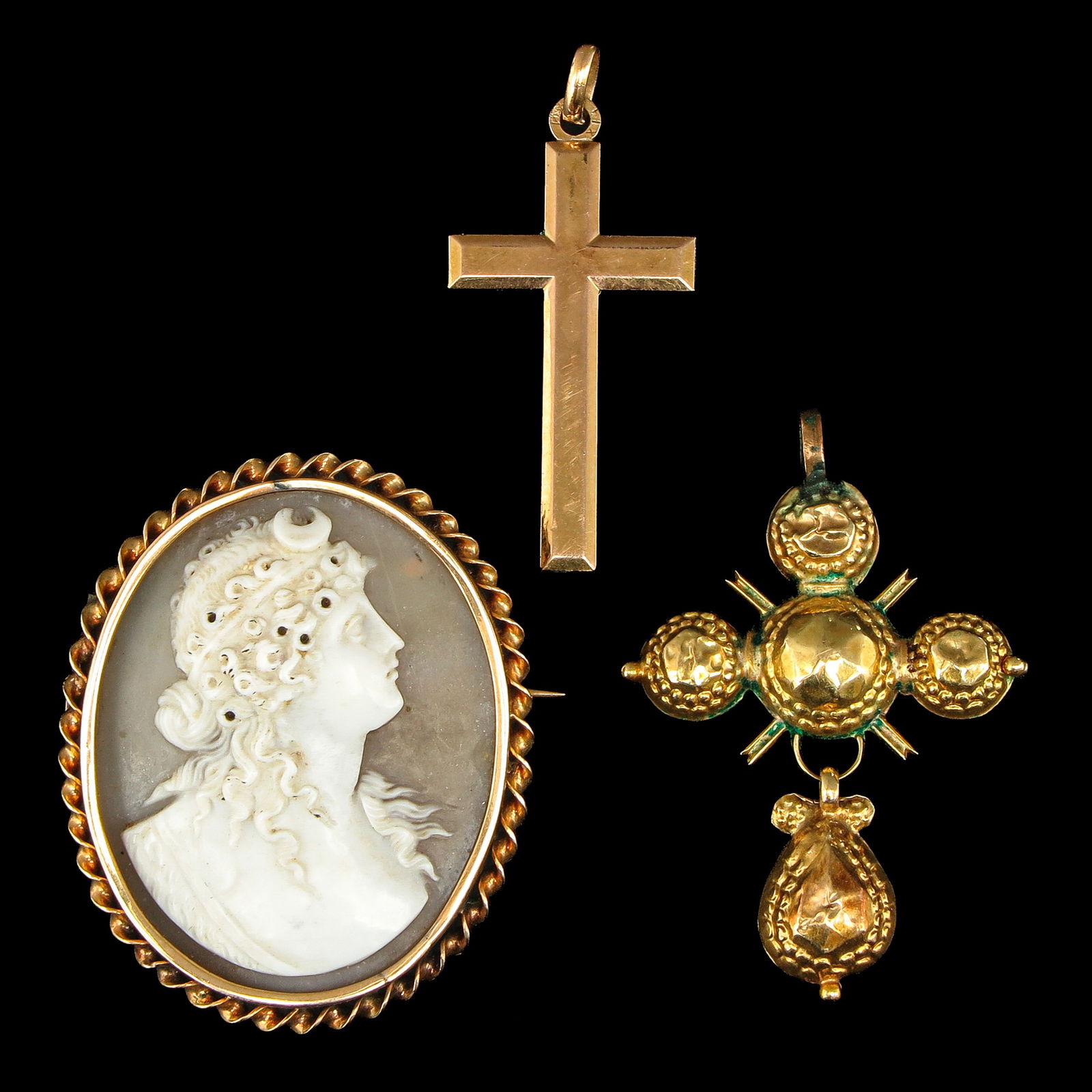 A Group of Jewelry: Consisting of two cross pendants and a cameo brooch, 31 x 36 mm, including gold.