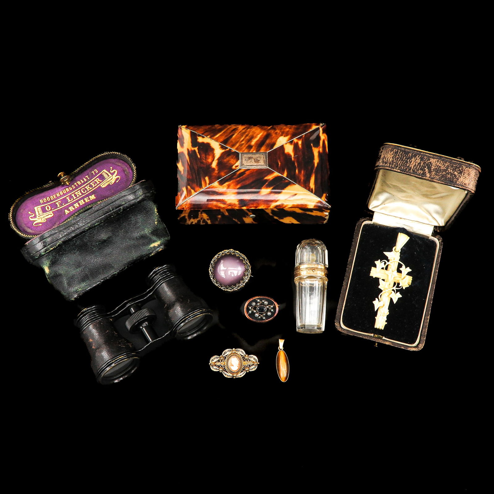 A Diverse Collection of Items: Various objects, including a crystal perfume bottle with a gold frame, height 7 cm
