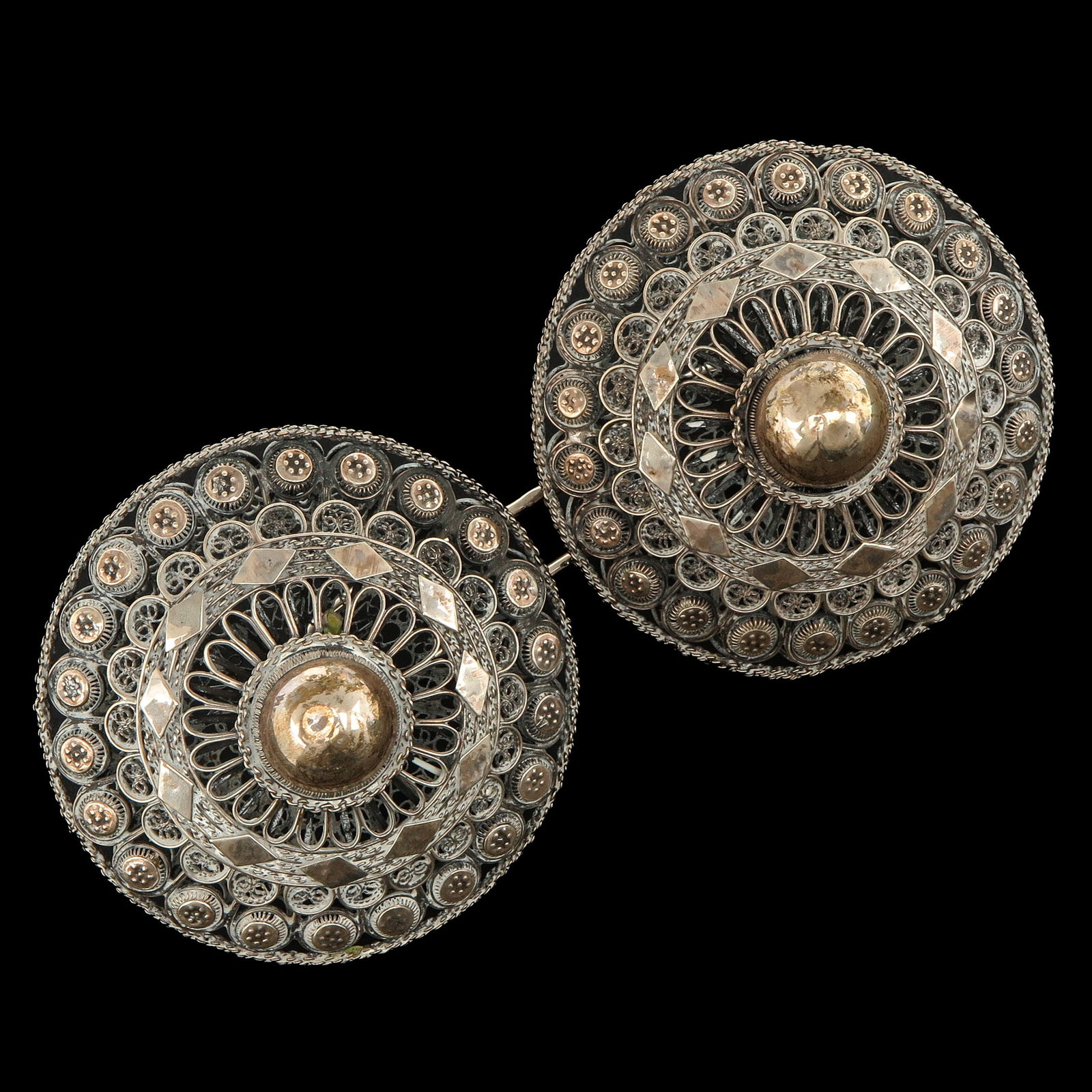 A Pair of Antique Silver Broekstukken: from South Beveland traditional costume, diameter 80 mm.