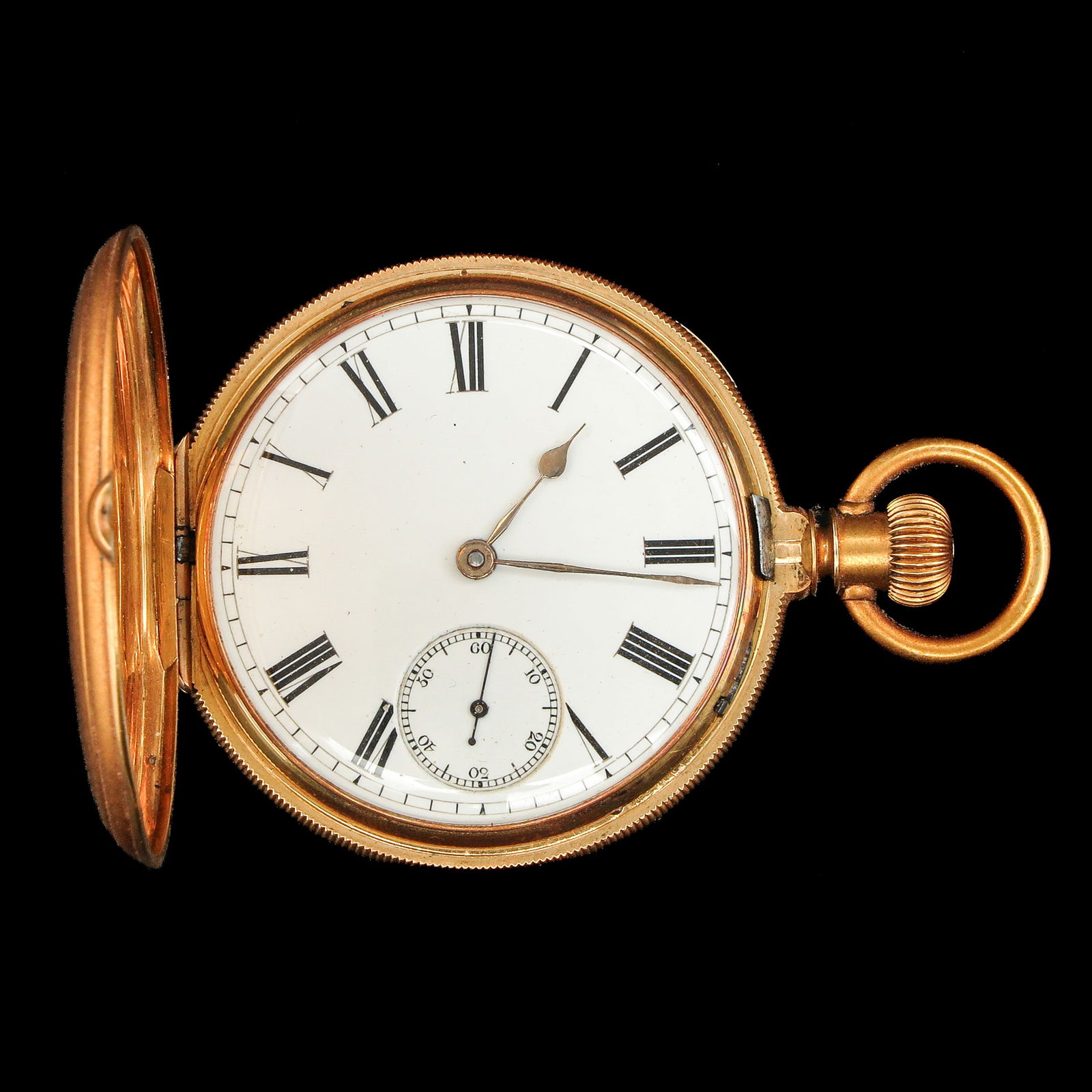 An 18KG Pocket Watch: 18K gold, in a carved wooden case, diameter 46 mm.